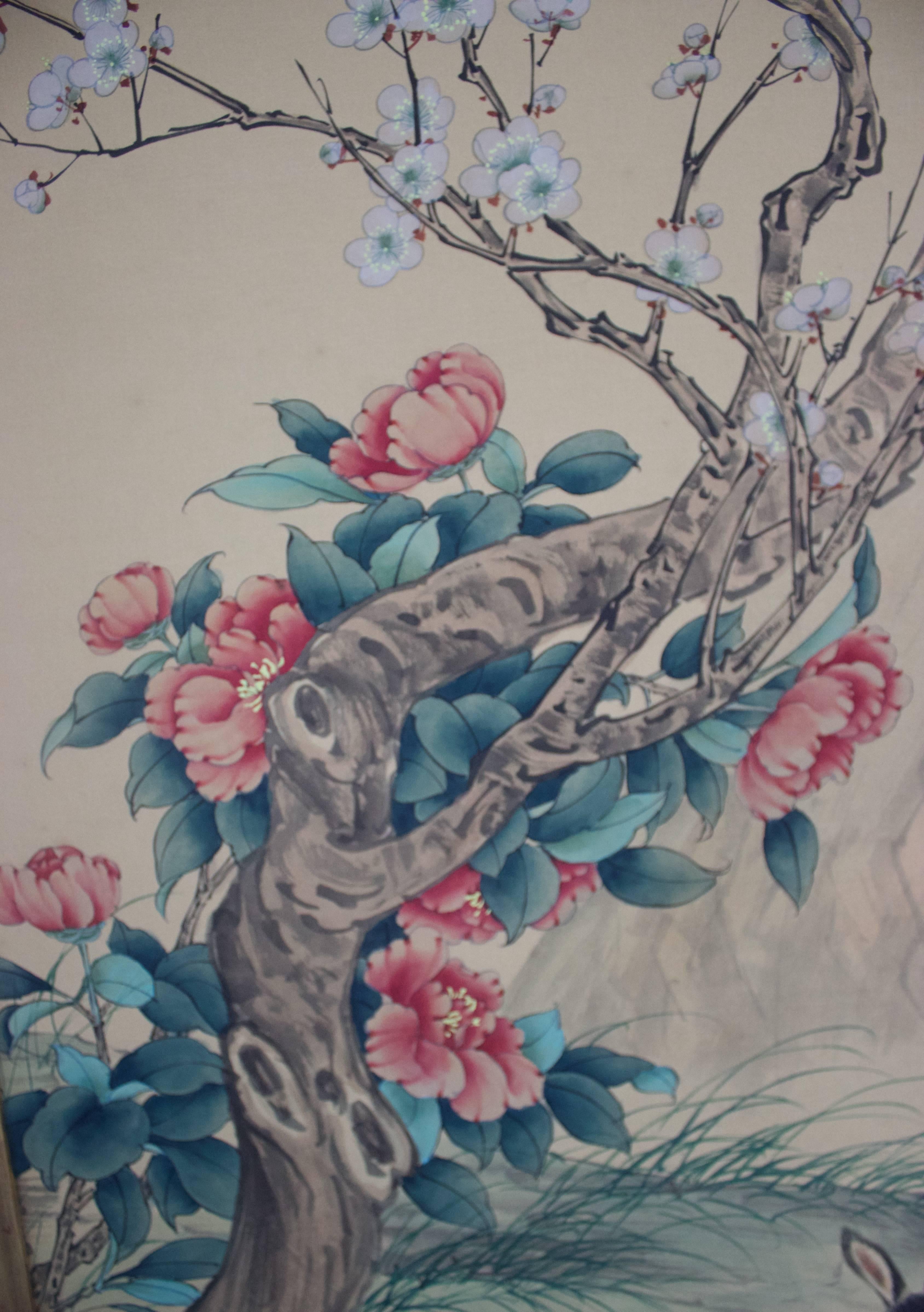 Lovely hand-painted on silk Chinese artwork depicting three rabbits (creativity and compassion) and blue birds. The painting is mounted and framed in a water gilt frame.