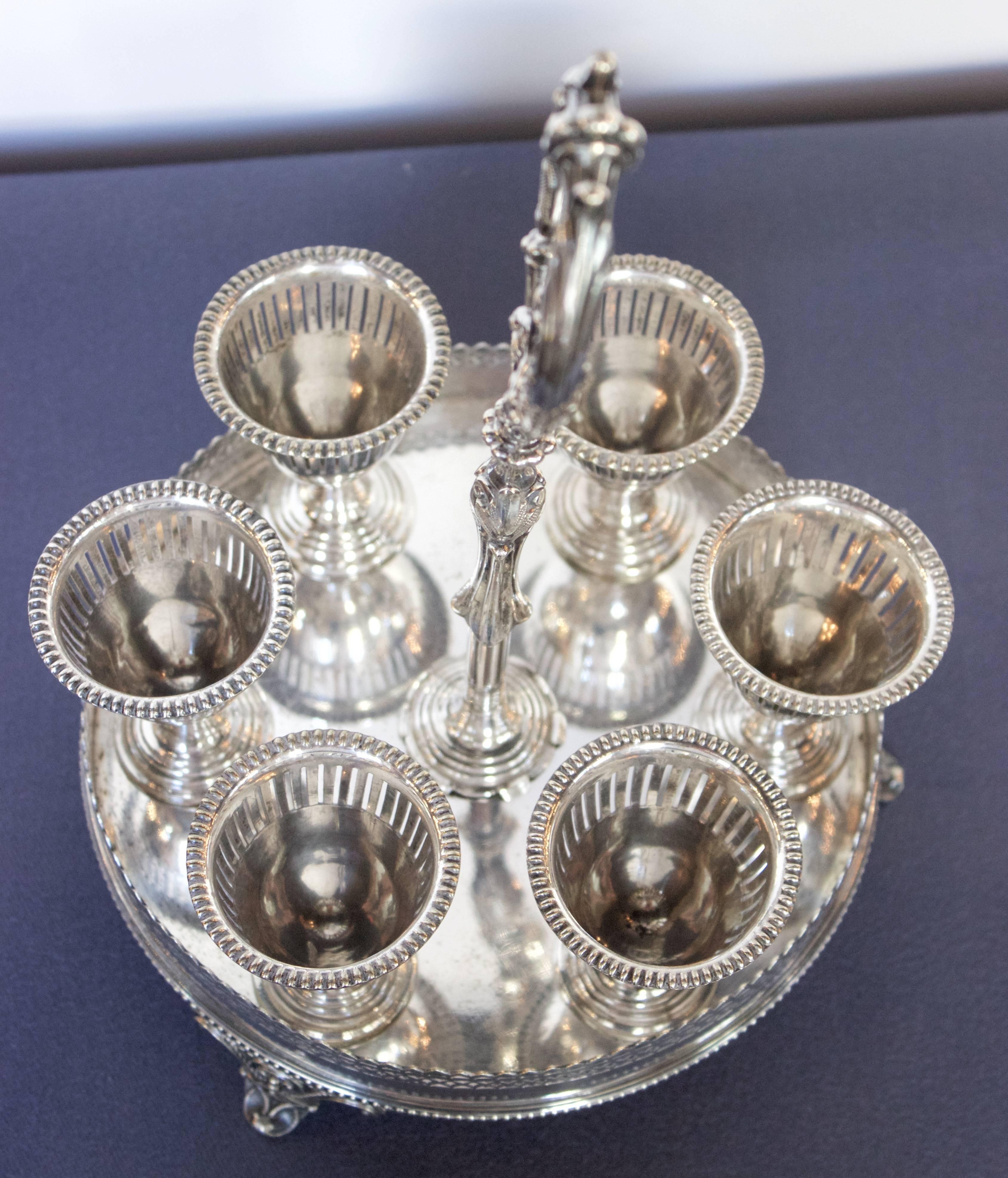 Beautifully silver plated set of six Eggs cup on a circular holder. All makers marks under the tray for William Hutton Company which became Silversmith and platters in Sheffield in 1832.