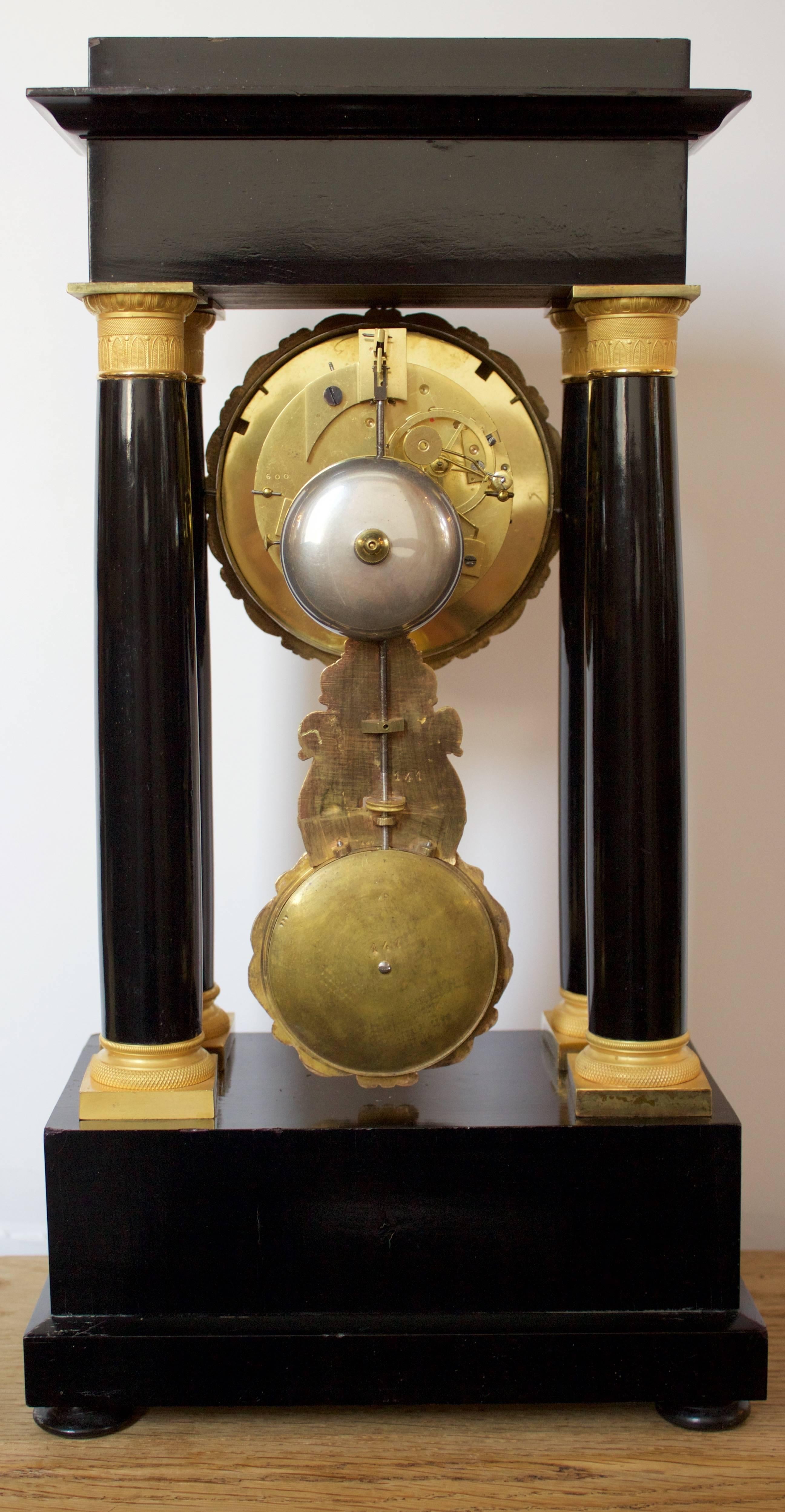 Early 19th Century Ormolu and Ebonized Wood Empire Portico Clock In Good Condition For Sale In Charleston, SC