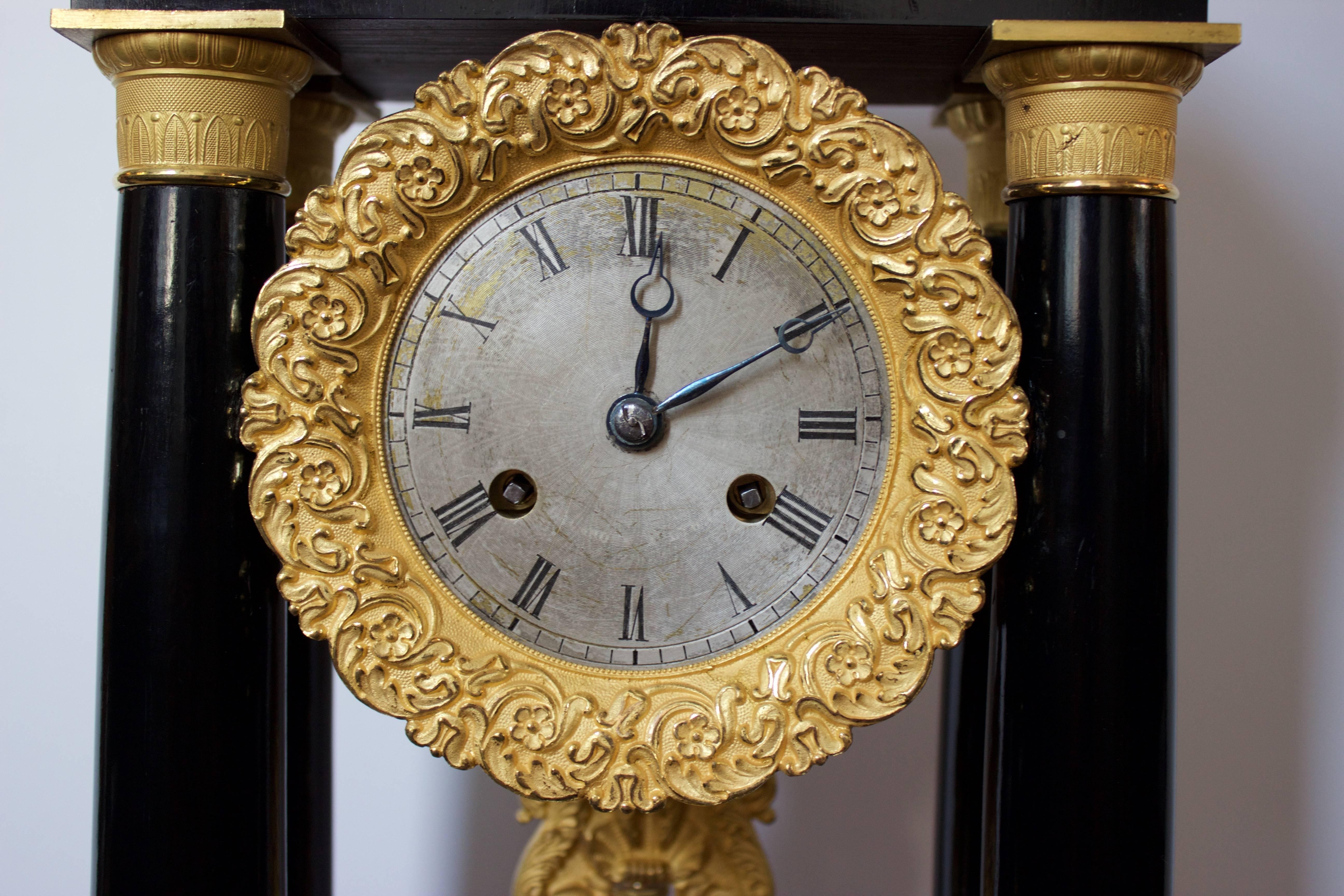 Brass Early 19th Century Ormolu and Ebonized Wood Empire Portico Clock For Sale