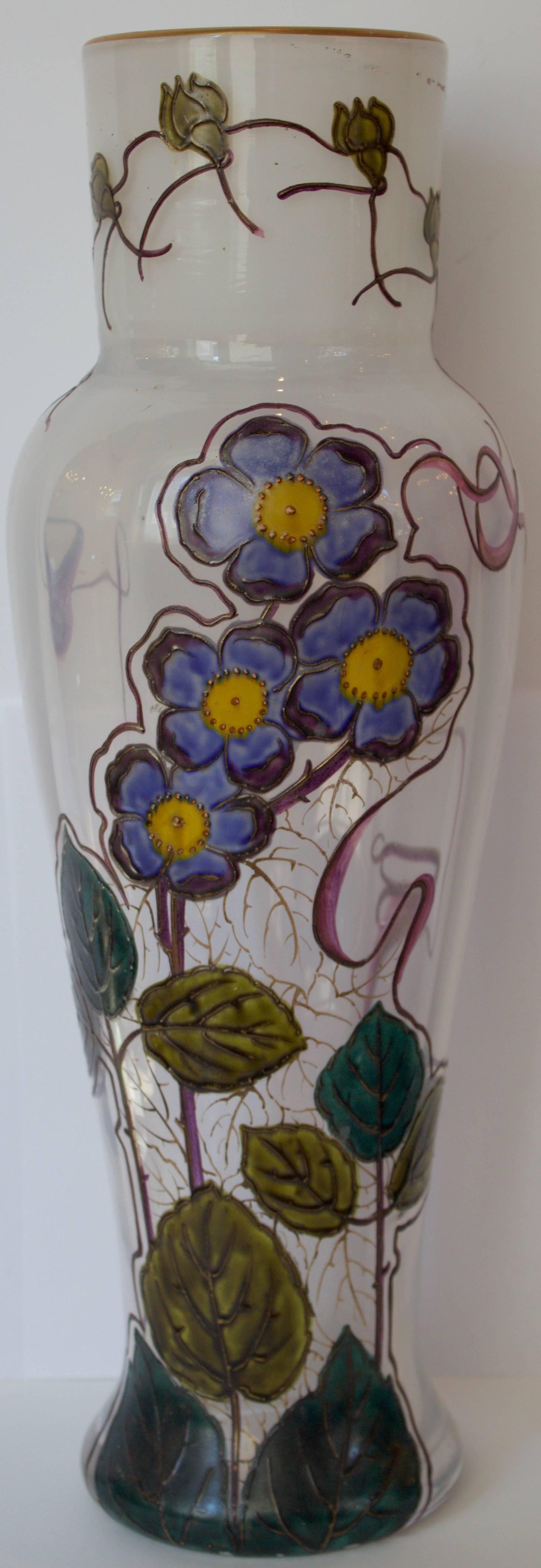 Rare slightly opalescent glass vase in baluster shape with a gorgeous enameled decor of pansy flowers and foliage. The Artist treated purposely the decor with freedom of expression as the branches are scrolling or are interrupted at top in order to