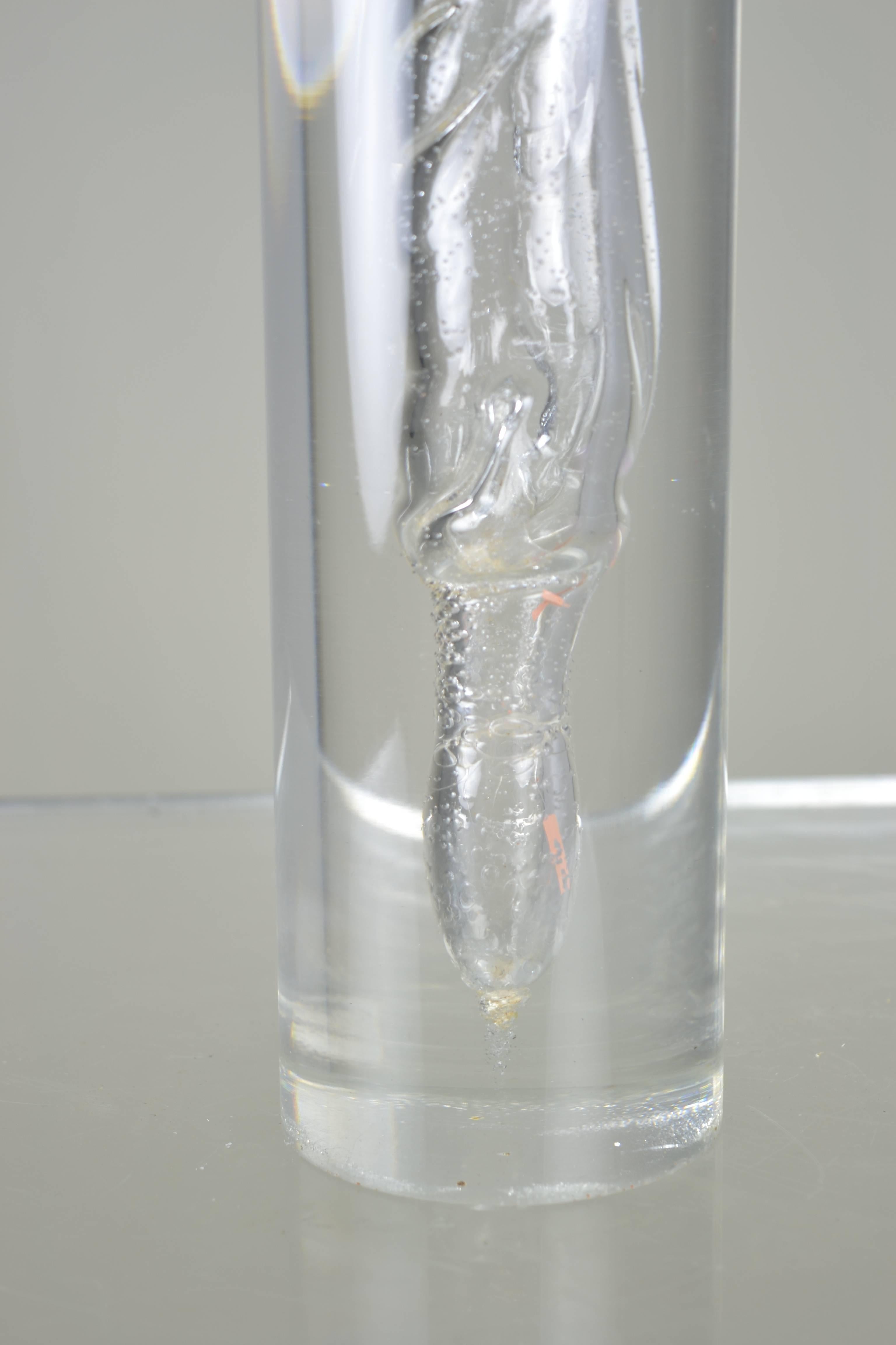 Internal bubbles and swirls in a heavy clear Lucite cylinder. Center hole. Measures: Great large size at 16.5" height.