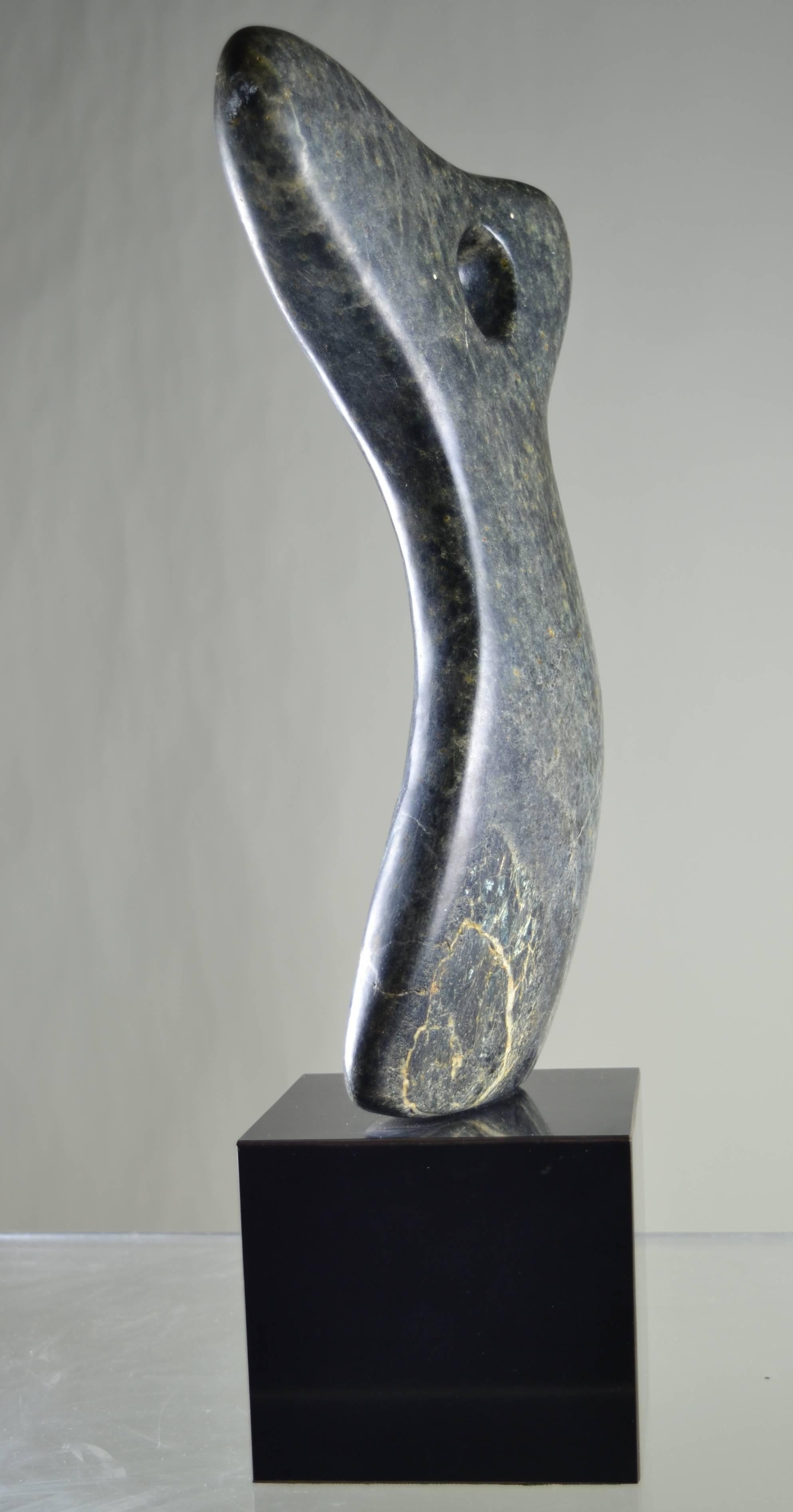 Fine sculpted abstract from a lovely piece of veined stone, affixed to a cubic base. Attractive size.
