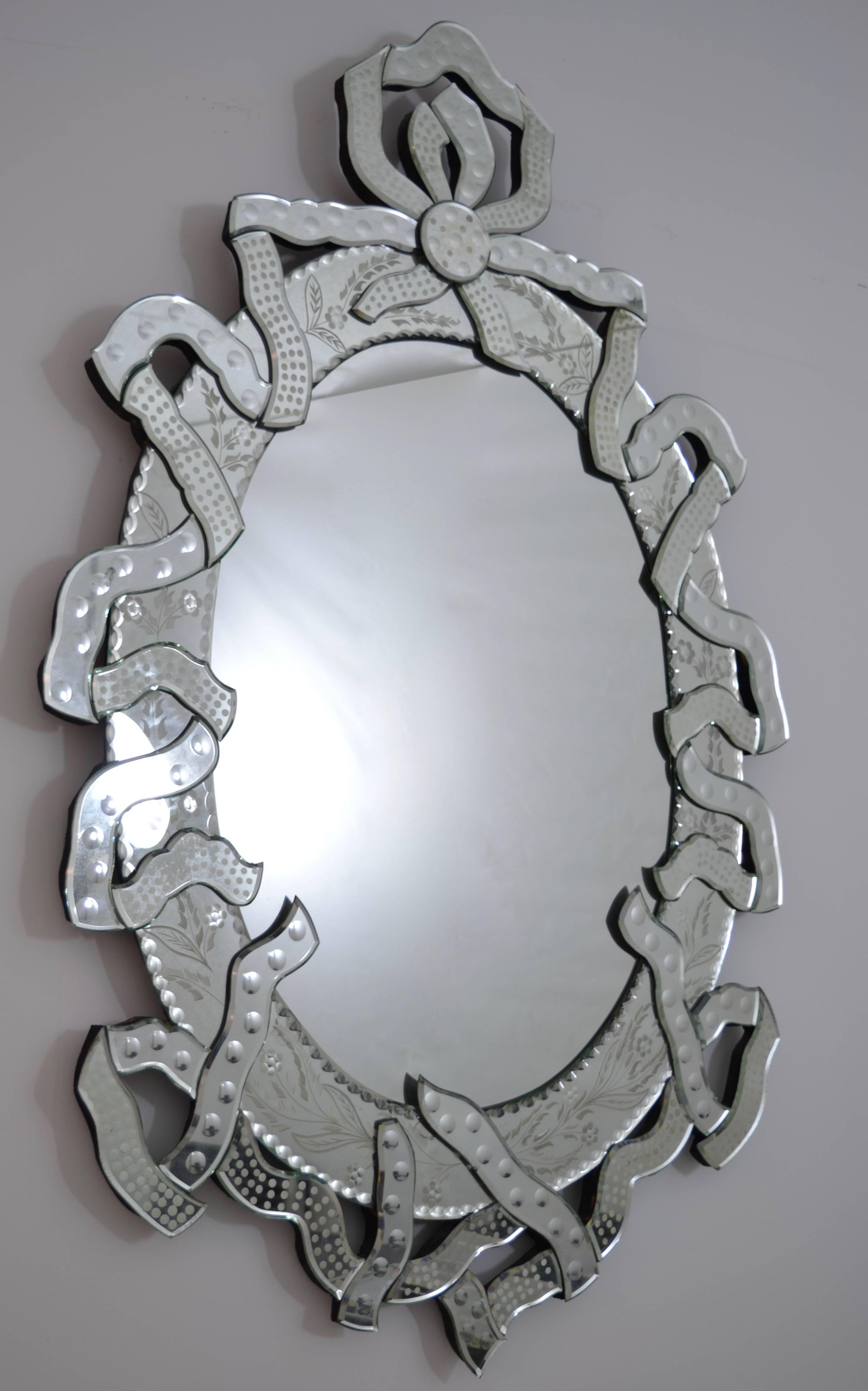 Charming mirror with a beautiful ribbon design border. Nice big size at: 54