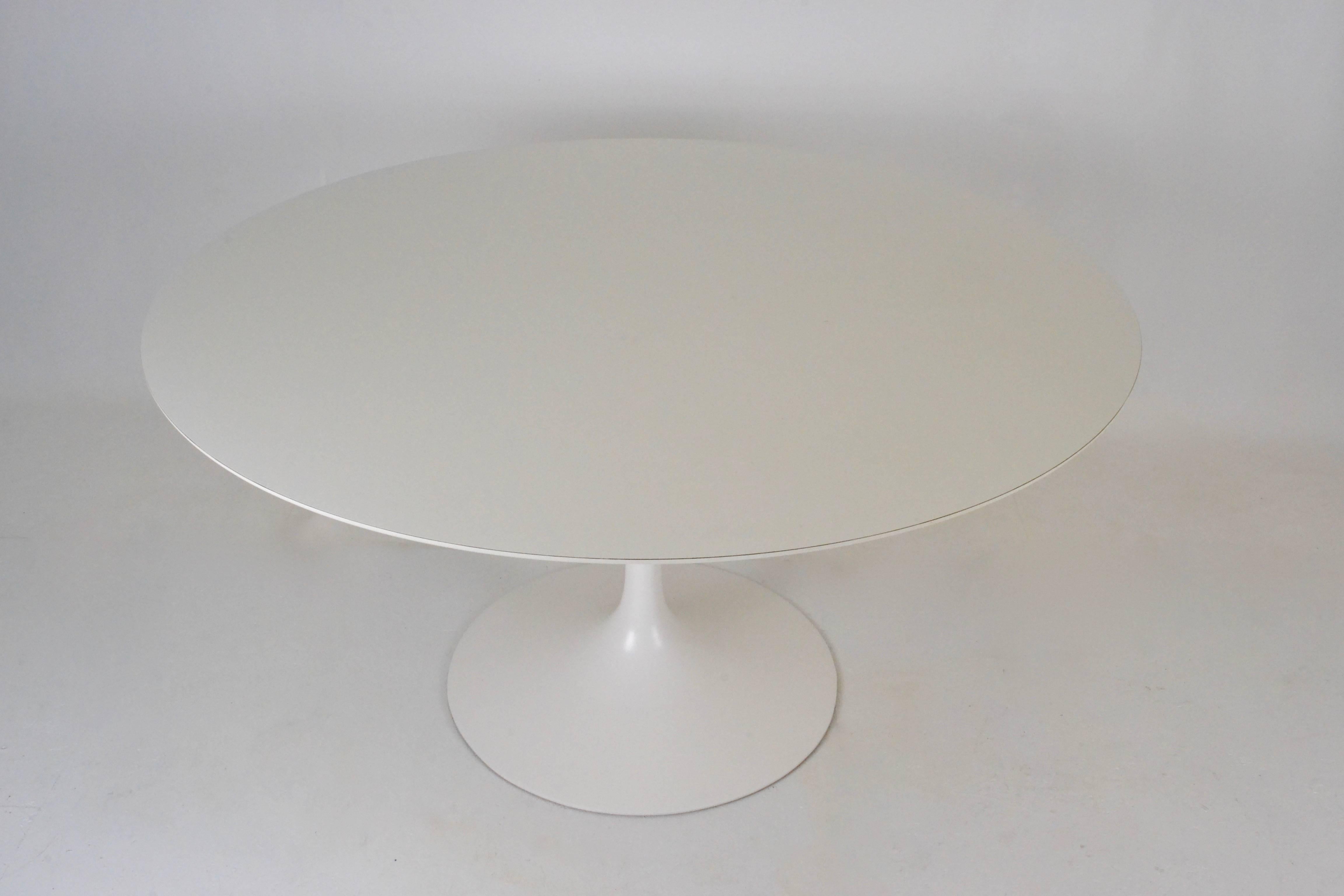 A very nice example of an early Saarinen table. Great size at 54". Base has been restored to excellent condition. Original laminate top is very, very clean with almost no wear.