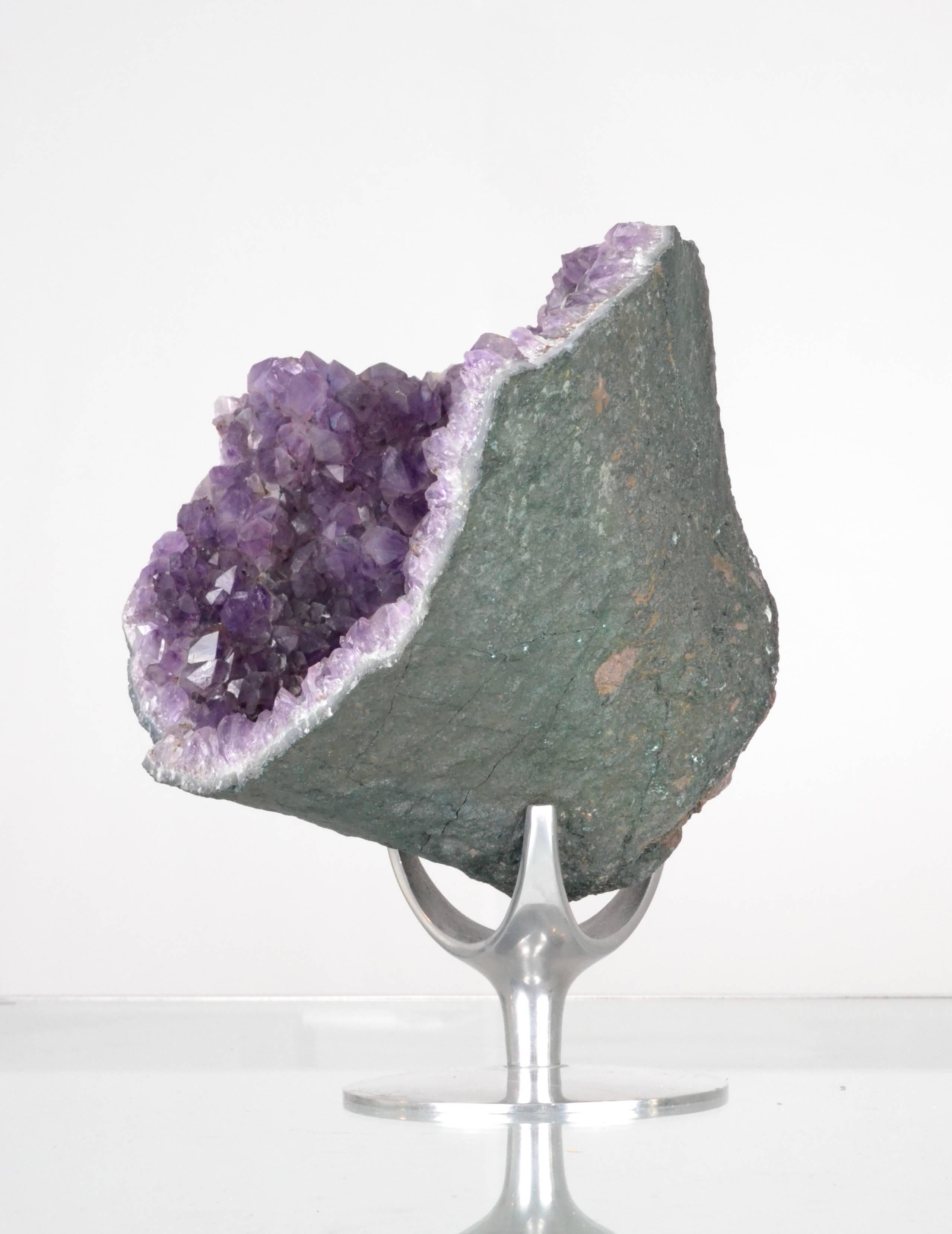 Beautiful amethyst crystal geode in a large size on a polished aluminum stand. Very impressive specimen, well presented. Geode alone measures: 11.5" wide; 9" high and 9" deep. On the stand it is 13" high.