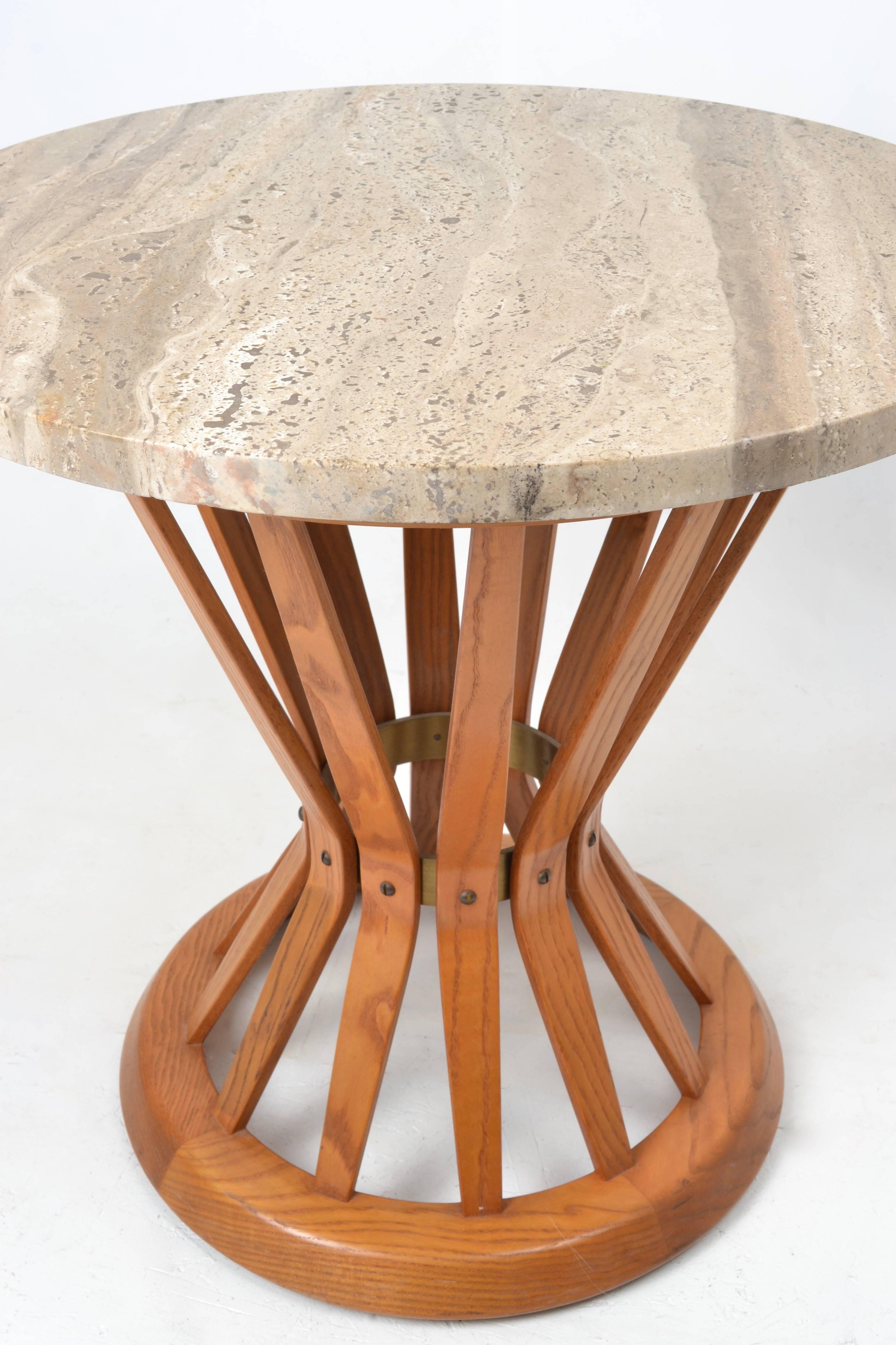 A very clean example of Edward Wormley's "Sheaf of Wheat" side table made by Dunbar, circa 1960s. Oak base with Italian travertine marble top. Both top and base in very fine condition. Dunbar tag attached to underside of table. Marble