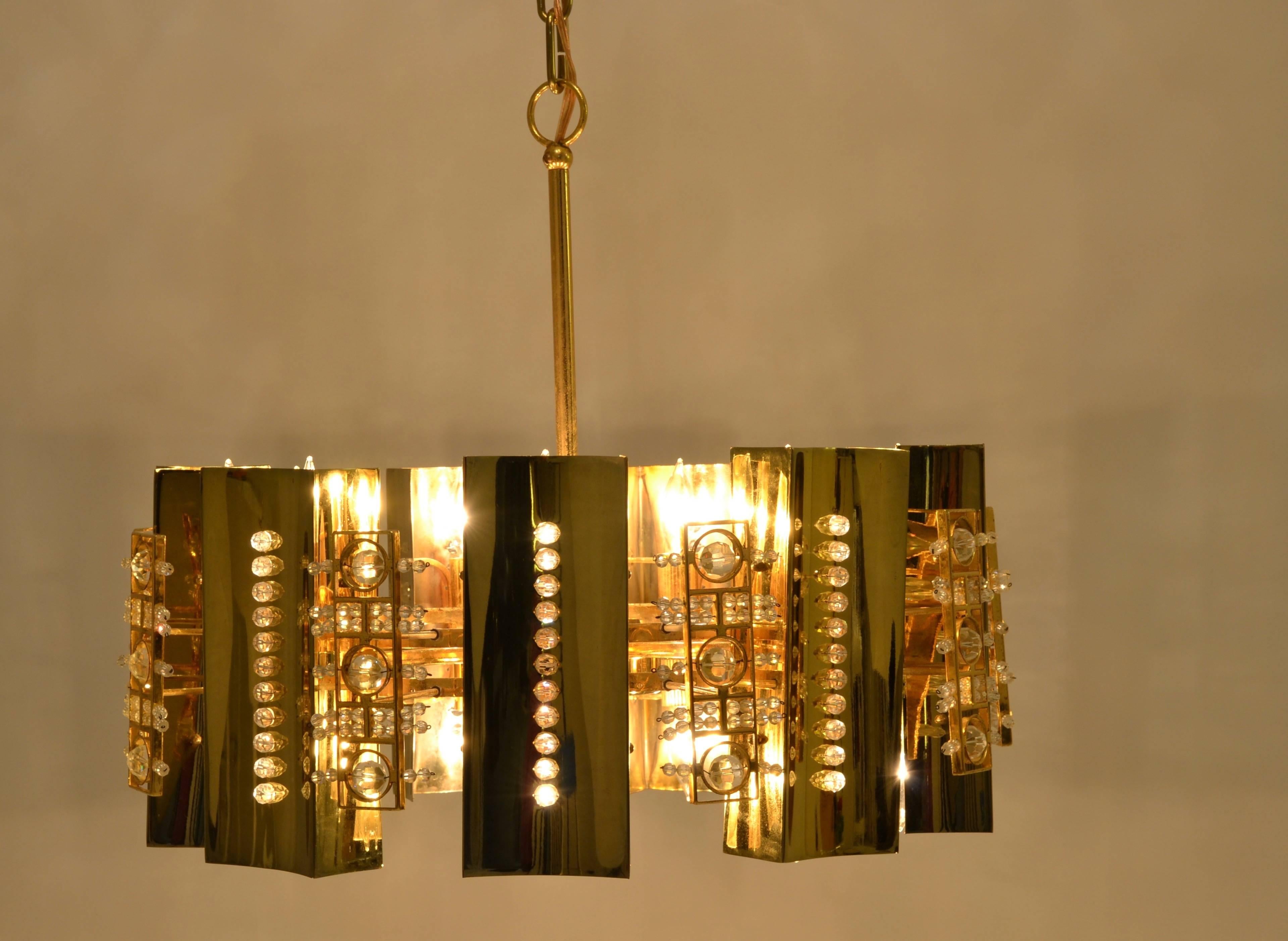Really glam! Sparkly crystals set in polished brass and gilt fixture. Nice size at 24 inch diameter and 19 inch depth to top of rod. Very nice quality. Note images that do our best to show how lovely this fixture looks when lit. It has two rows of