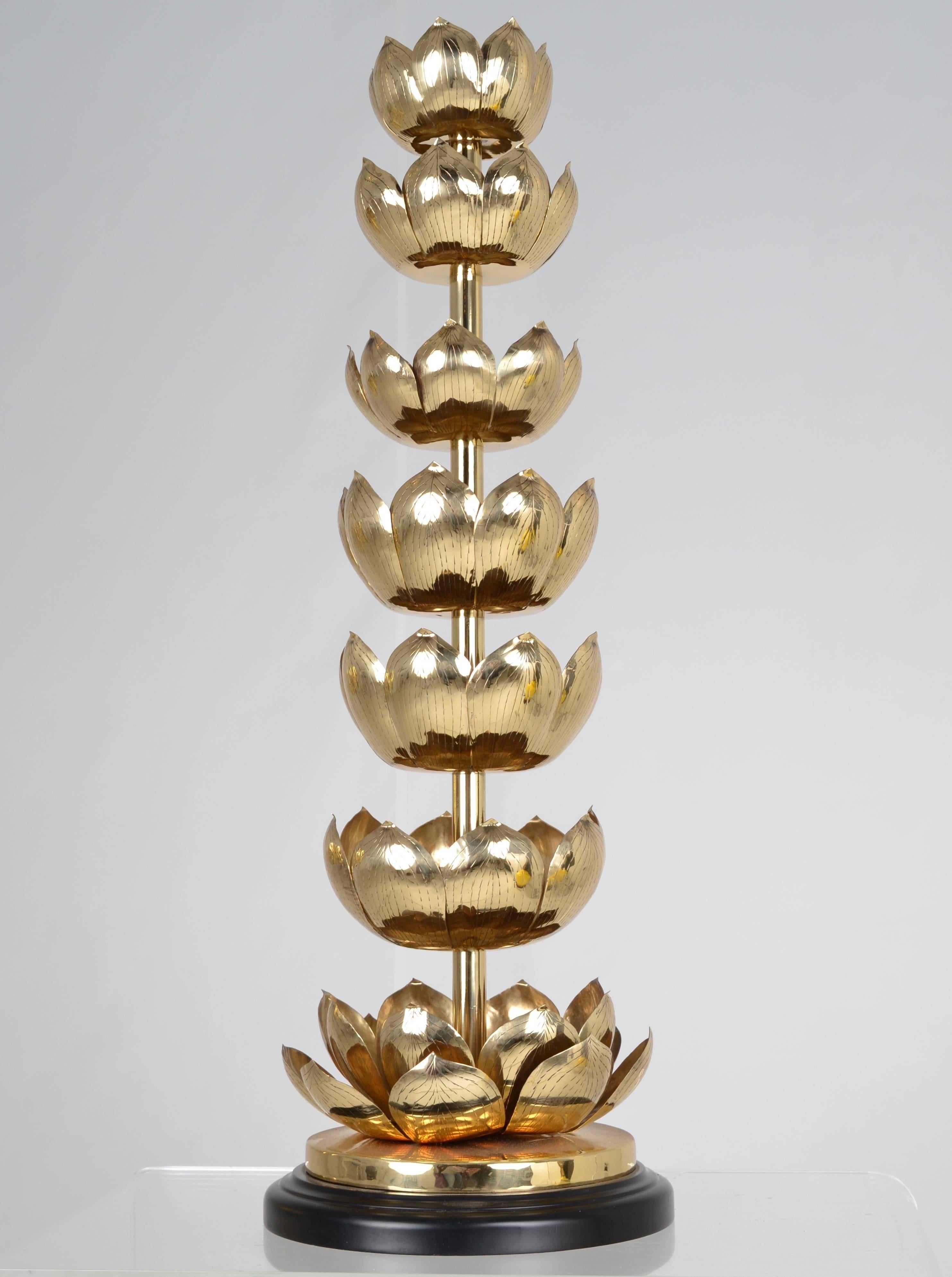 This dramatic candlestick in the Classic lotus flower motif is solid brass, newly polished and lacquered. Simple black base. Great size at 32 inches high and 11 inches diameter.