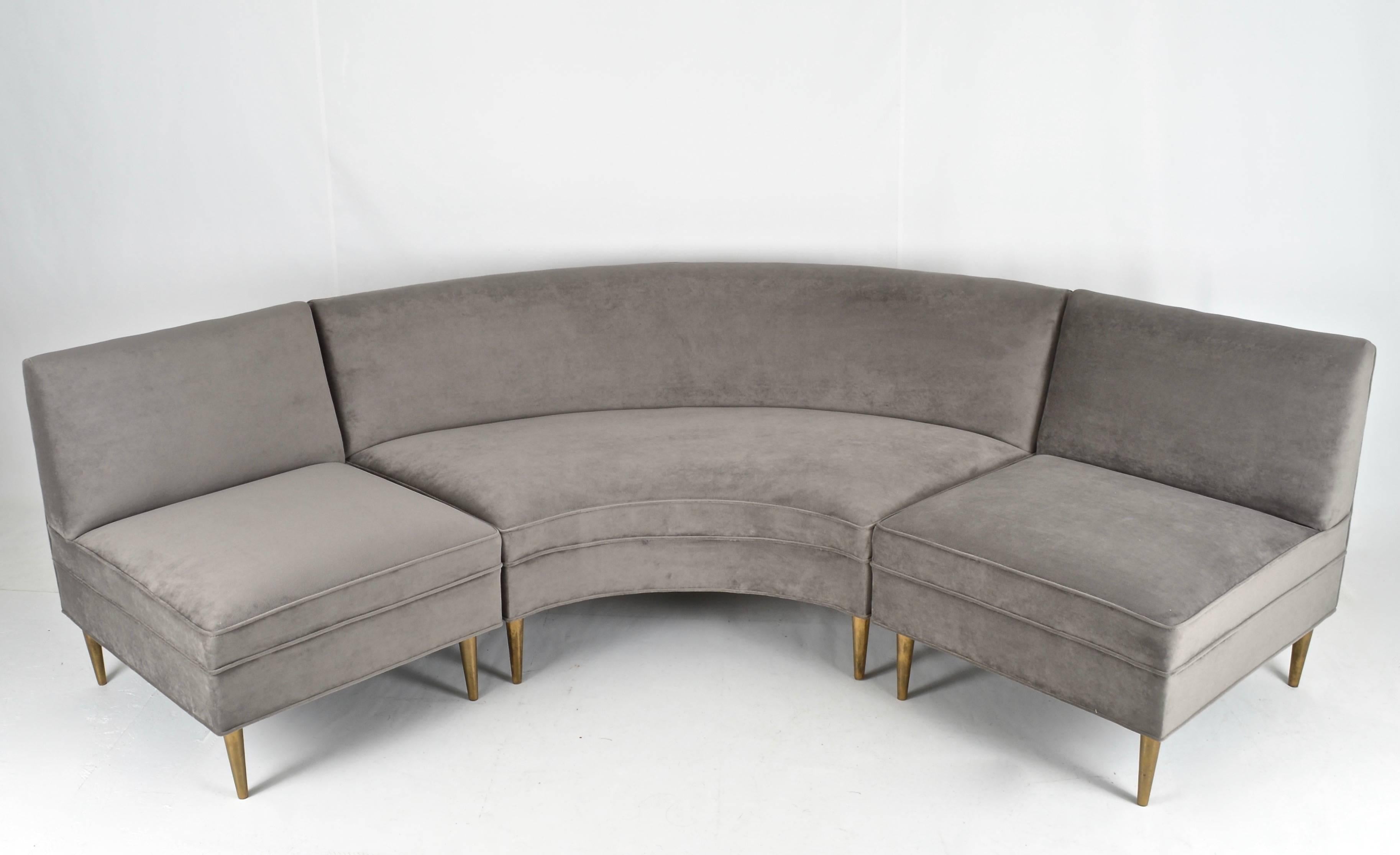 Wonderful scale on this relatively petite sofa. Tight seat and back, reupholstered in taupe velvet. Gold-finished metal legs with sophisticated tapered form.