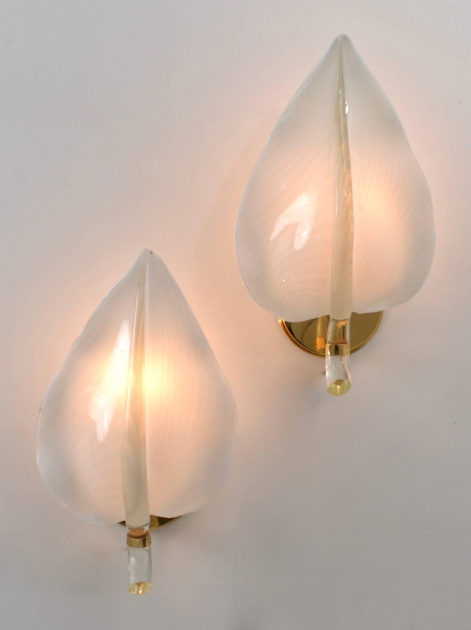 Hand blown Murano Glass leaves featuring a subtle striped pattern, set into a brass fixture. They take a standard bulb up to 60 watts. New wiring. 