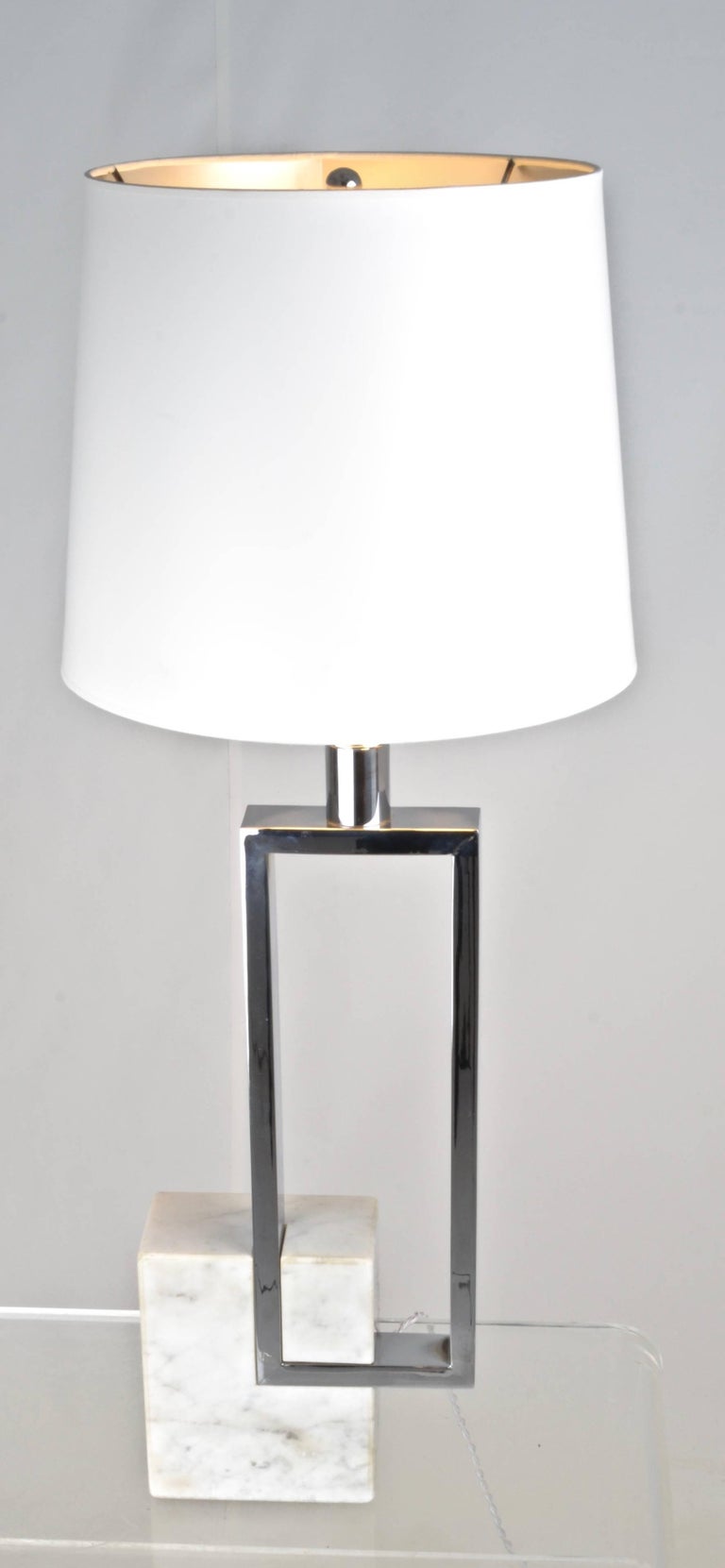 Sculptural lamp with great quality. Heavy chrome and marble. Premium lamp fittings. New wiring. Dimensions of lamp without shade: Depth 3.25 inches, Width 8 inches, Height 31.5 inches. Shade 12 inch diameter, 10 inch height.