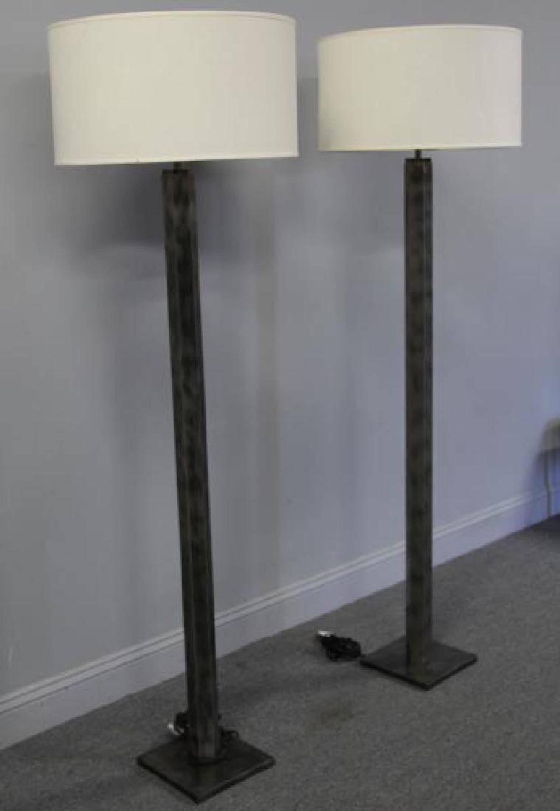 Pair of Industrial steel floor lamps, each one of good weight and nicely cast, with a 9.5 inch square pedestal base. Shades are for display purposes only.
Shown with 21