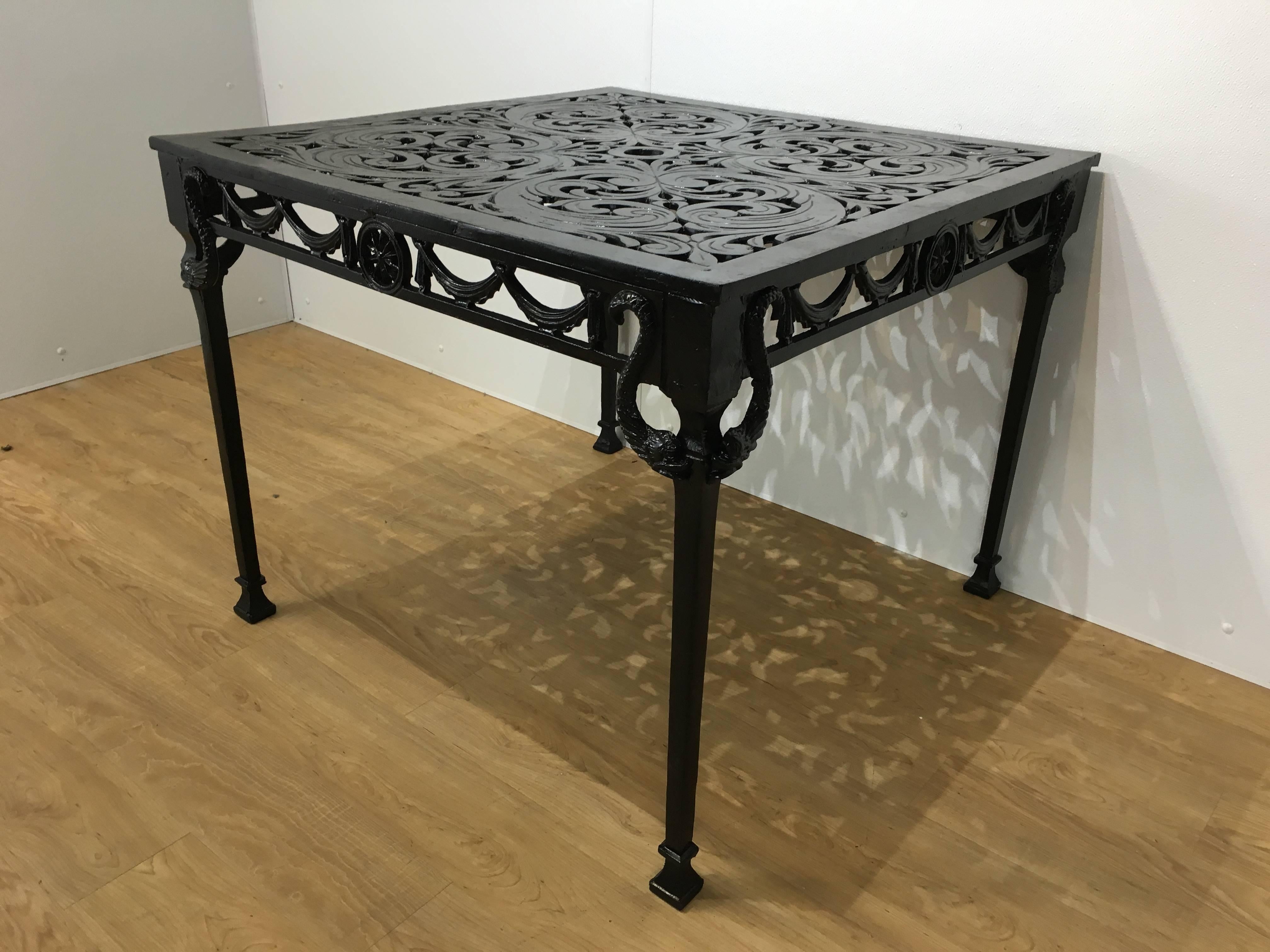 Molla neoclassical dining table, of square form with pierced top and frame. Retains original weathered finish with new enamel paint.
 