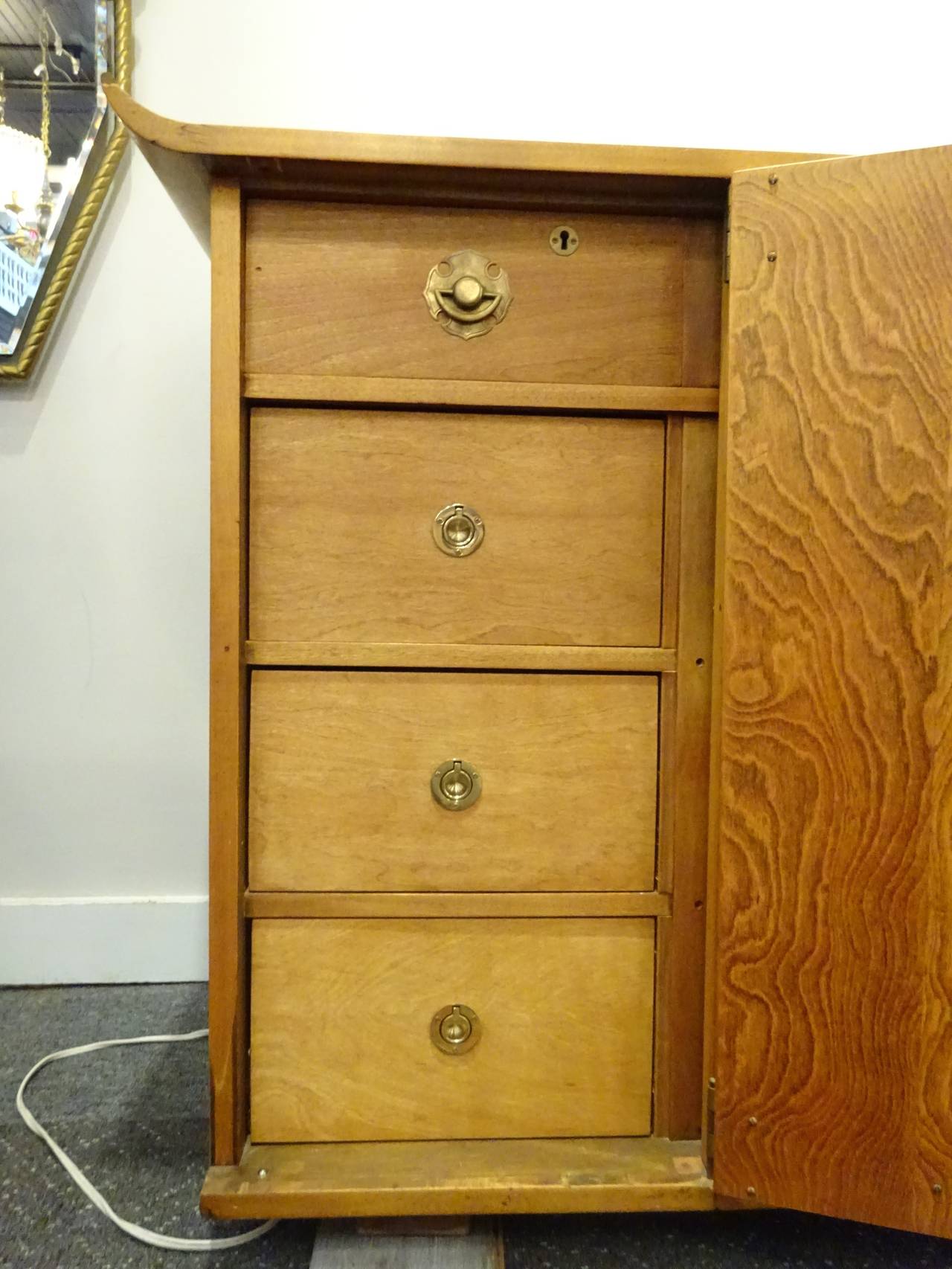 Midcentury Asian teak credenza or sideboard by Mildred Warder
Fitted with four cabinet doors open to a generous amount of drawers, shelves and compartments.
Plaque on back reads 