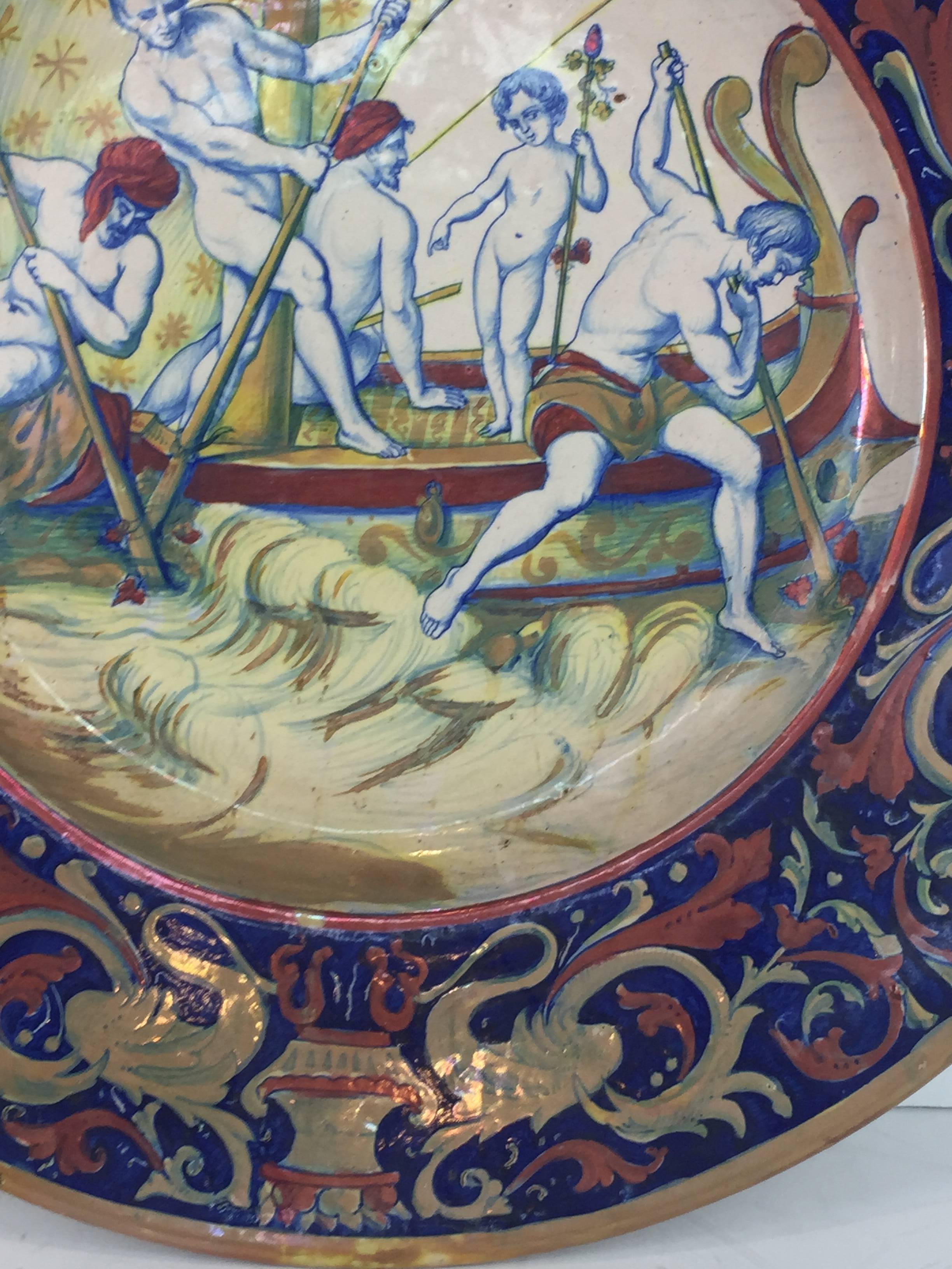 Italian Faience Charger Lusture (Cantagalli Style Decoration) kidnapping of Dionysus or Bacchus, of circular form with intricate Florentine border, the center decorated with an allegorical scenes of the kidnapping of Bacchus, marked and inscribed on