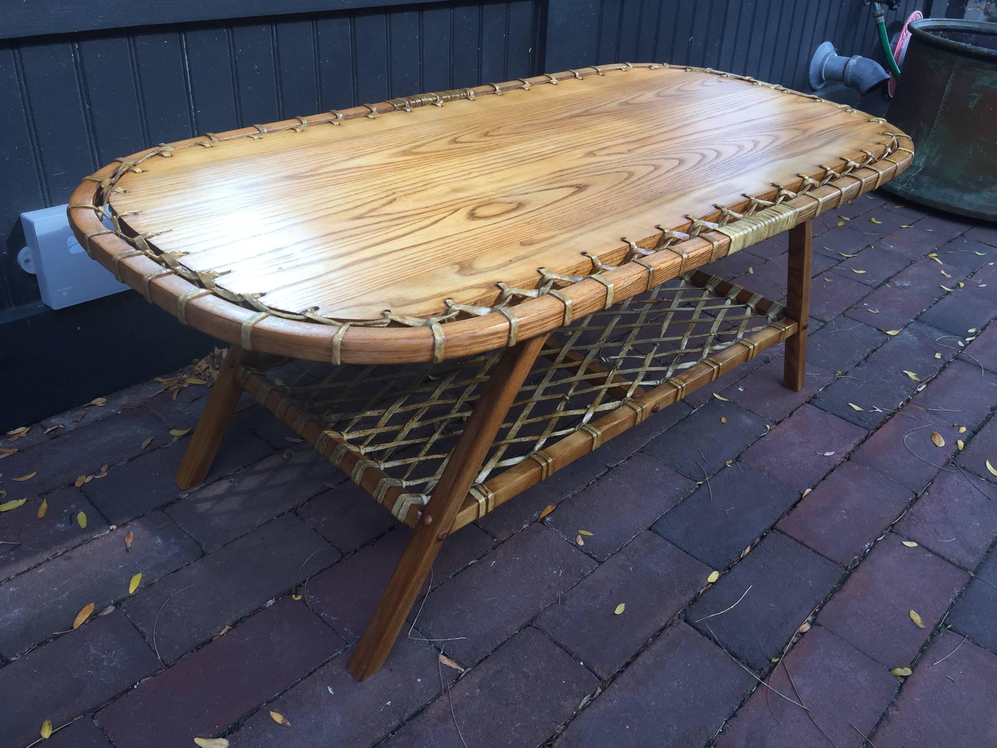Adirondack Oak & Rawhide Coffee Table, Beautifully made oval oak and rawhide interlaced two-tiered coffee table. We have a matching rocking chair and chair available, 1stdibs item number LU92053421052