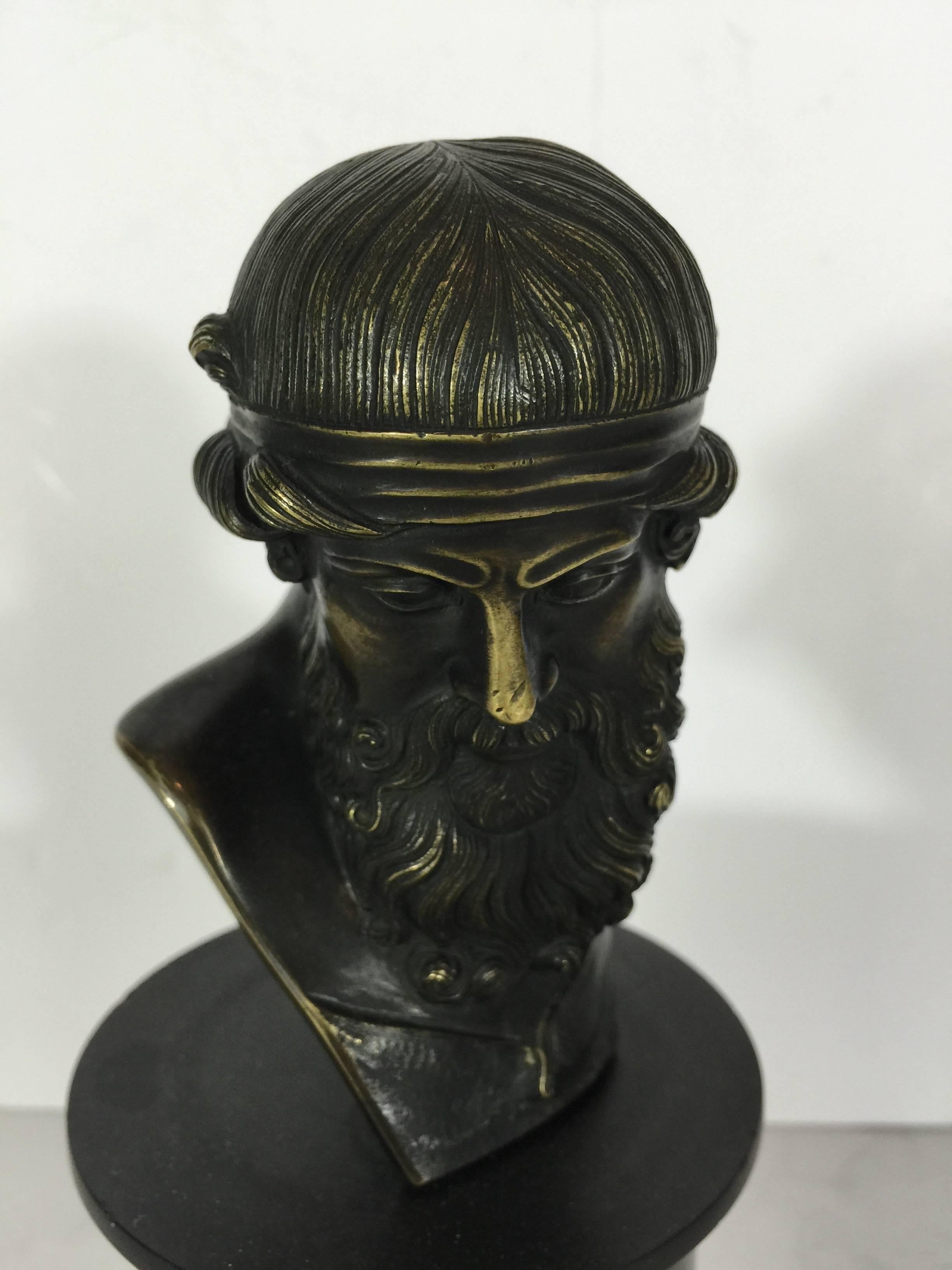 Grand tour bronze portrait bust, tabletop size, exceptional casting, unsigned on its original marble solace. The bust without the base is 4" H x 3" D x 2.5" D, the base alone is 4" H x 3.75" diameter.