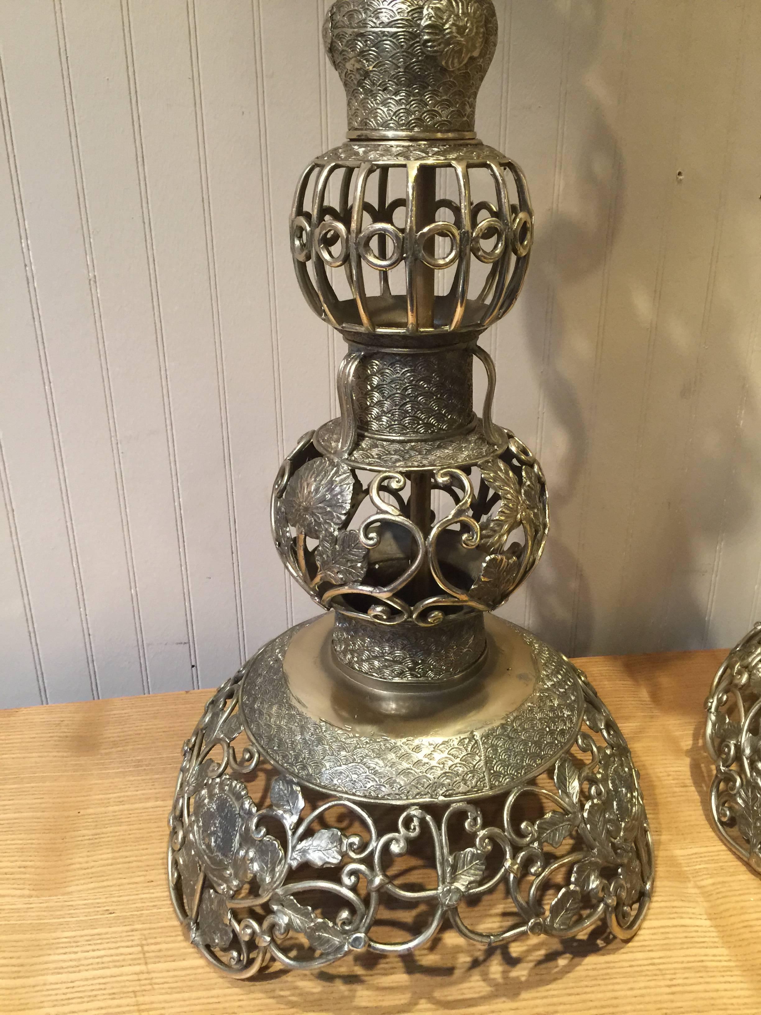 Pair of Large Chinese Brass Table Lamps, Each one of Alter Candlestick form, now electrified, beautifully cast, chased and pierced brass.