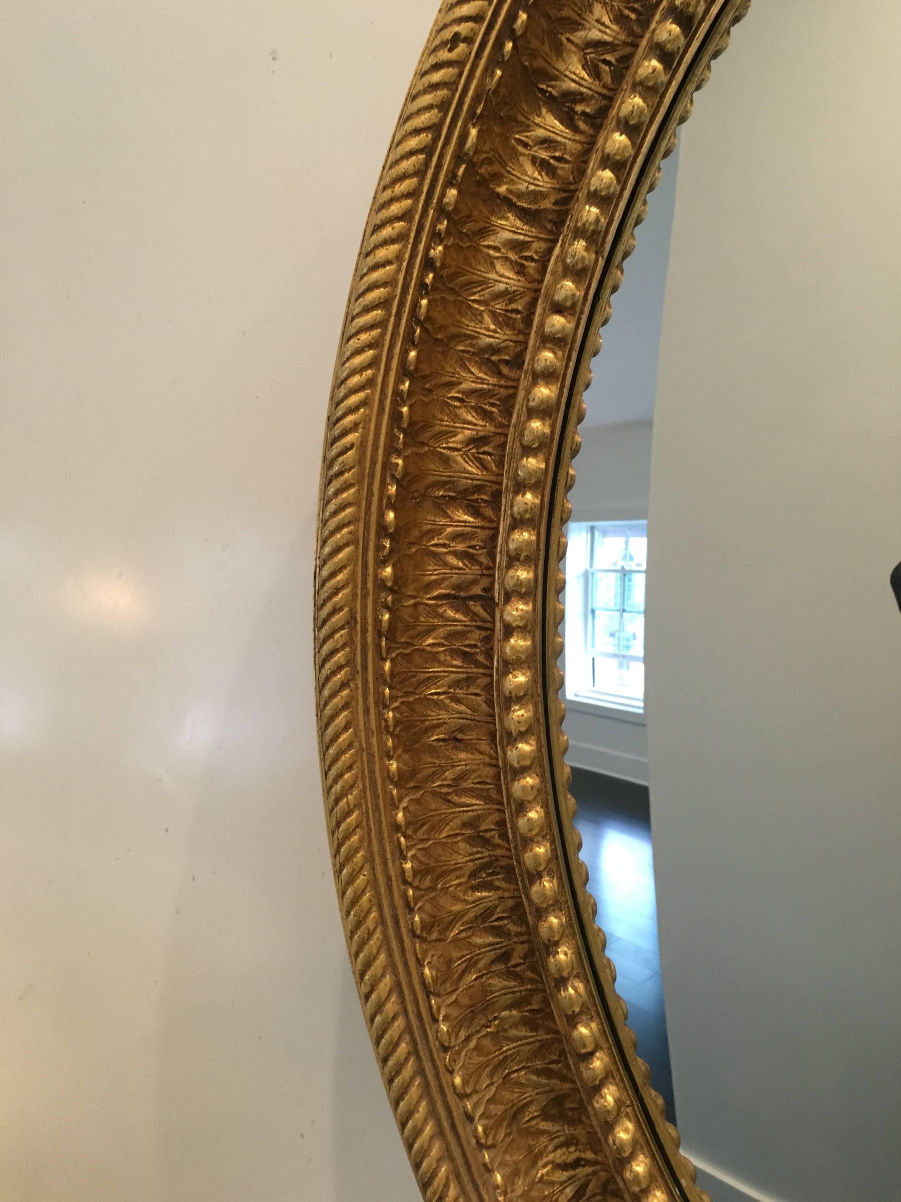 Monumental Regency style gilt convex mirror, beautifully modeled gilt composition and acrylic convex mirror. Presents well, Fresh form a Princeton NJ Estate.