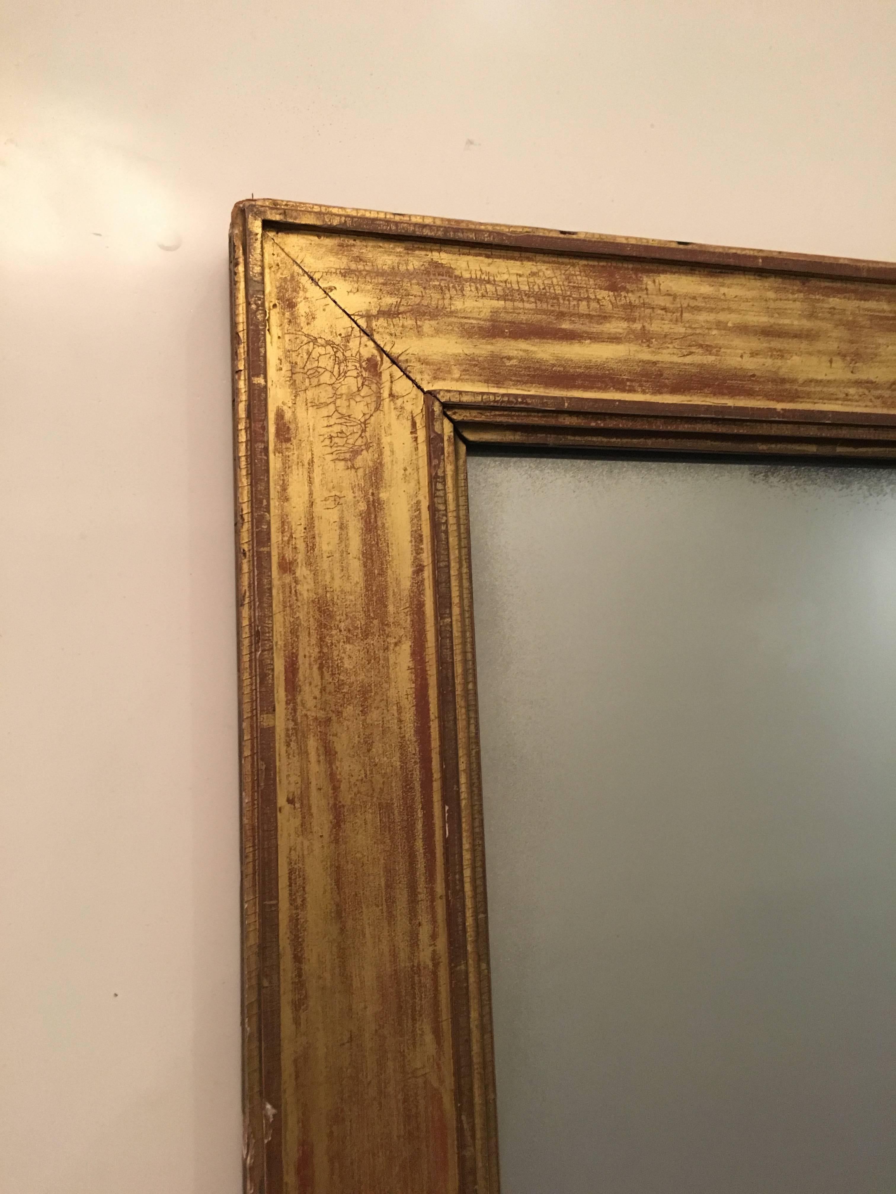 Massive Louis Phillippe giltwood mirror, of rectangular form, with fine 