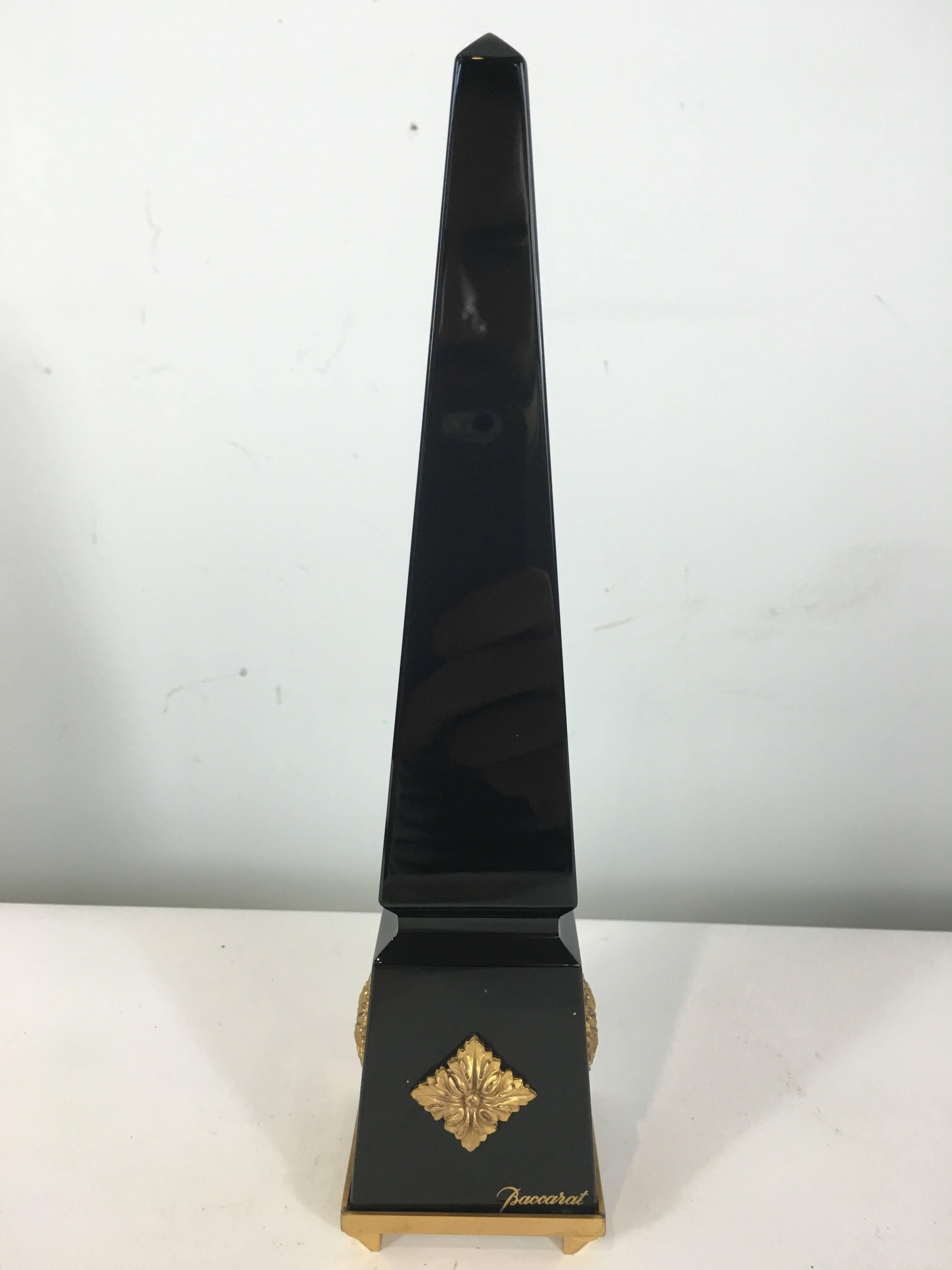 Baccarat black crystal obelisk of typical form with ormolu mounts.