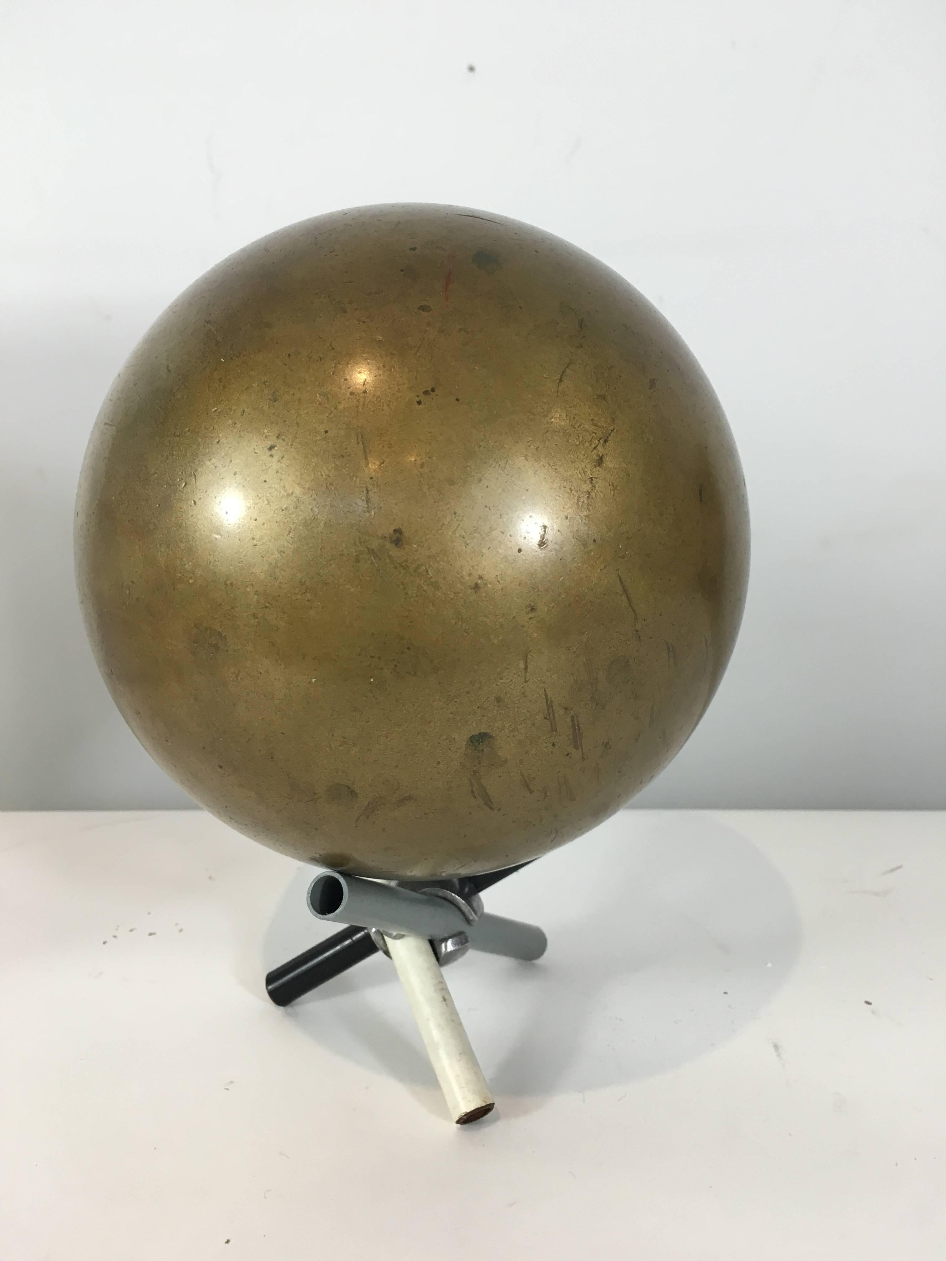 19th Century Bronze Cannon Ball, accompanied with a later three color calder style tripod base, weighs approximately 50lbs 
The metal & pvc stand is 3