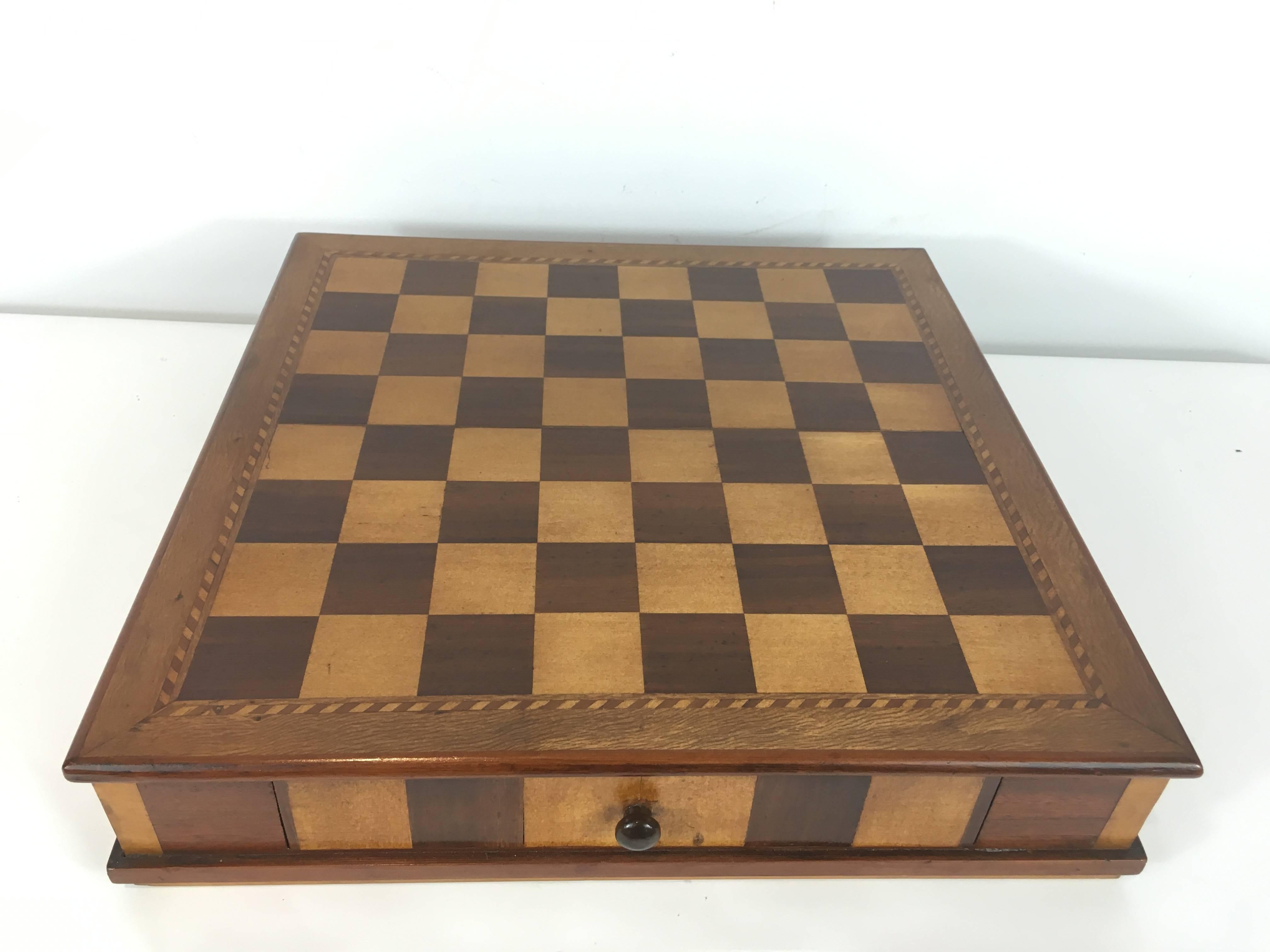 Victorian Chess Set, Of square form with inlaid exotic woods, all self contained with pull out drawer with 32 hand craved chess pieces