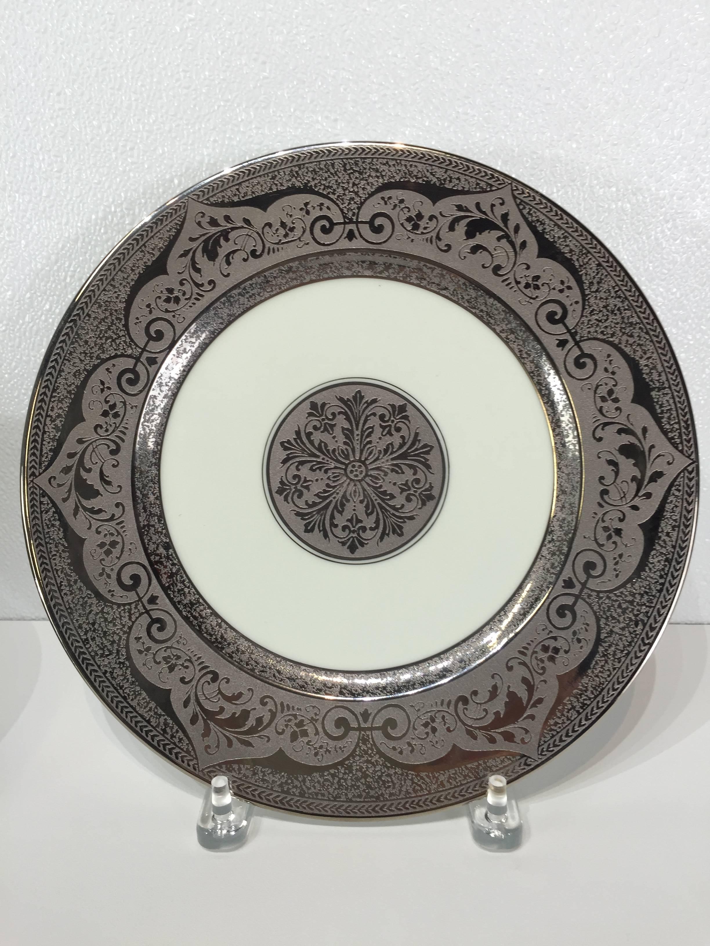 12 platinum  encrusted service plates, by Heinrich and Co., with rich 2.5