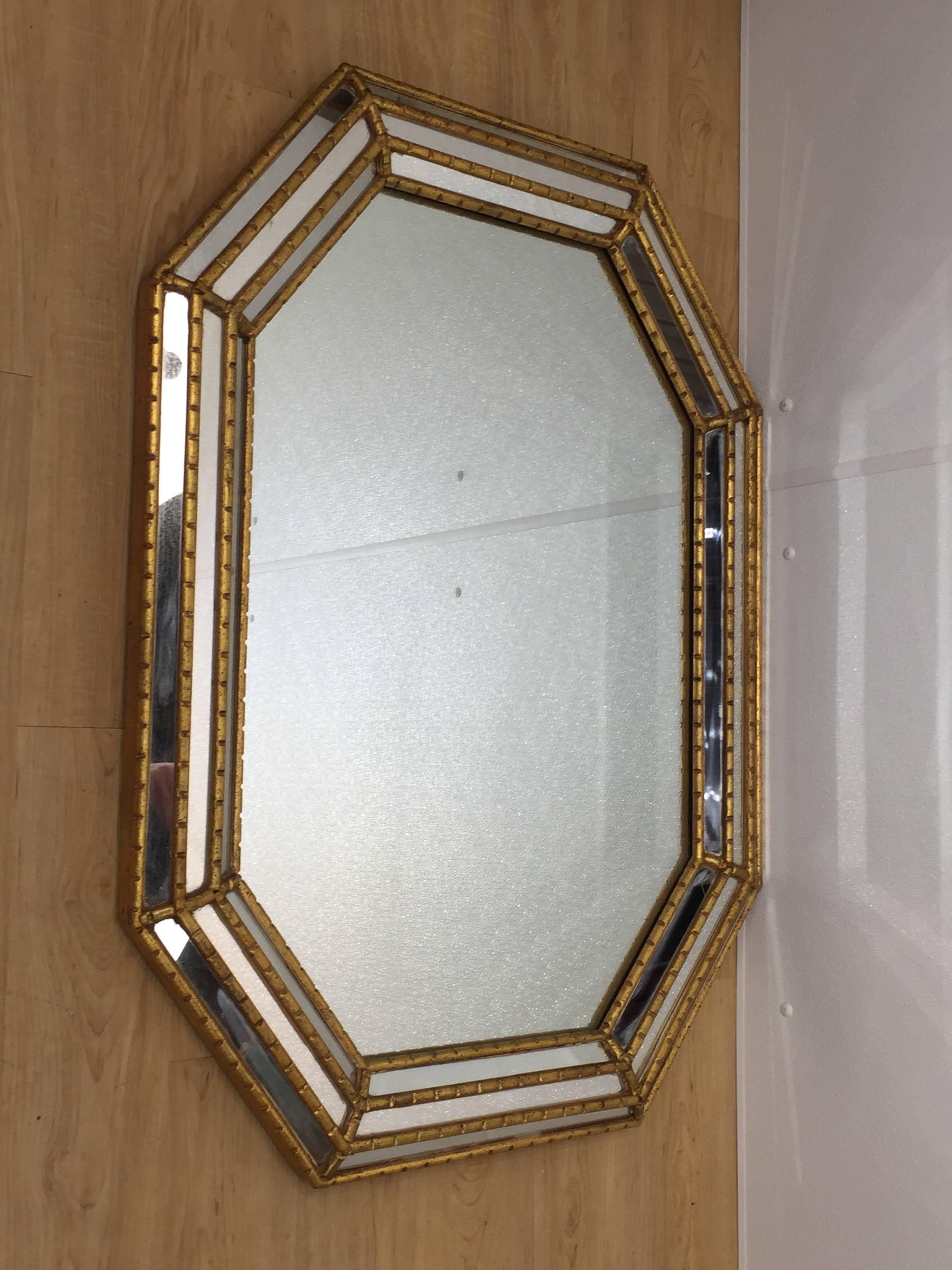 La Barge octagonal giltwood mirror with continuous surround of three raised mirror panels with large central mirrored plate. Marked La Barge. Made in Italy.