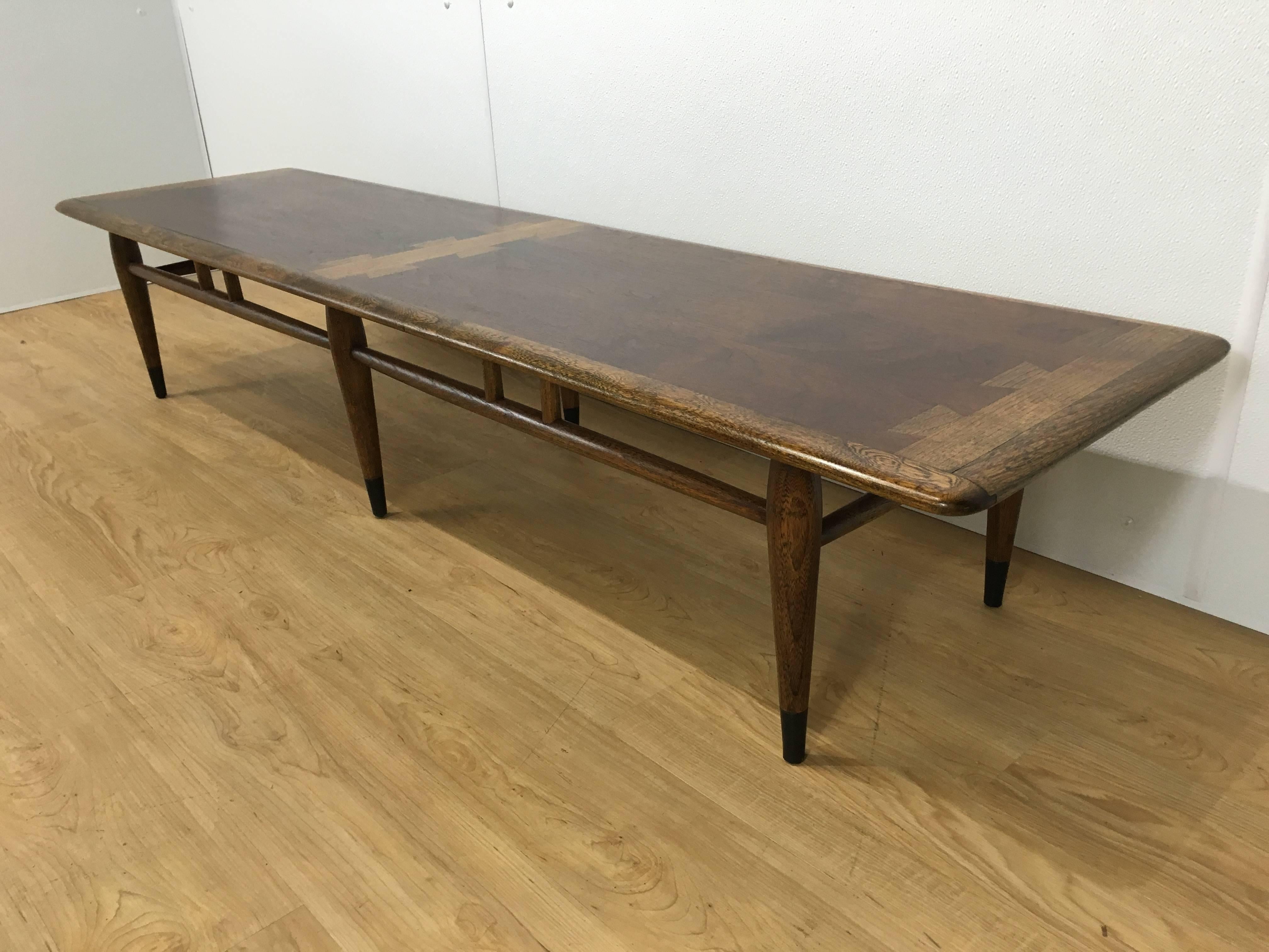 Extra long Lane Dovetail coffee table, 70" inches in length, iconic Mid-Century design. Similar to Grinard #1112. Expertly finished.