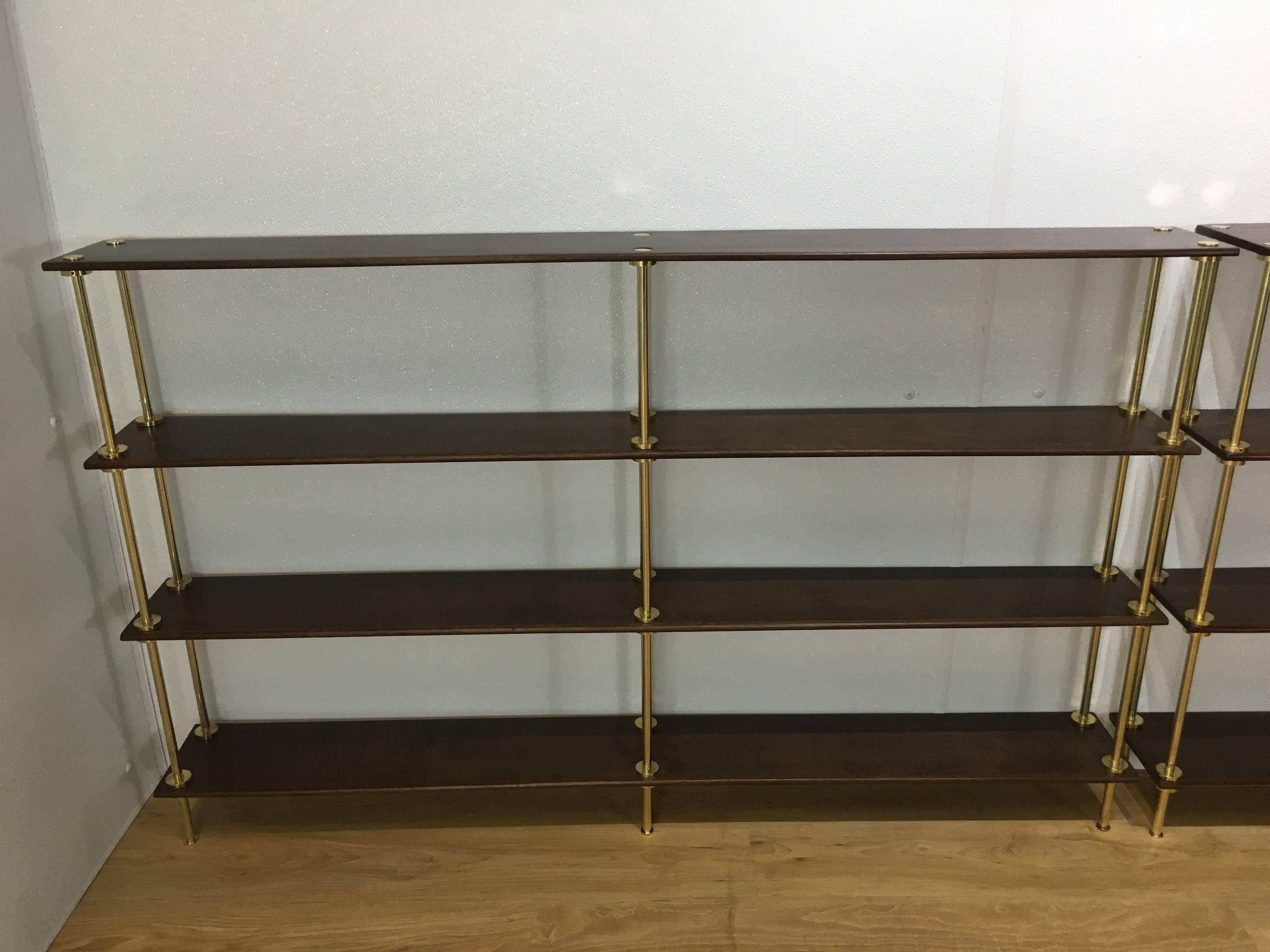 Near pair of diminutive Campaign bookcases, each one rectangular form with four beautiful long board mahogany shelves with polished brass columns.
Dimensions of shelf 1: 54