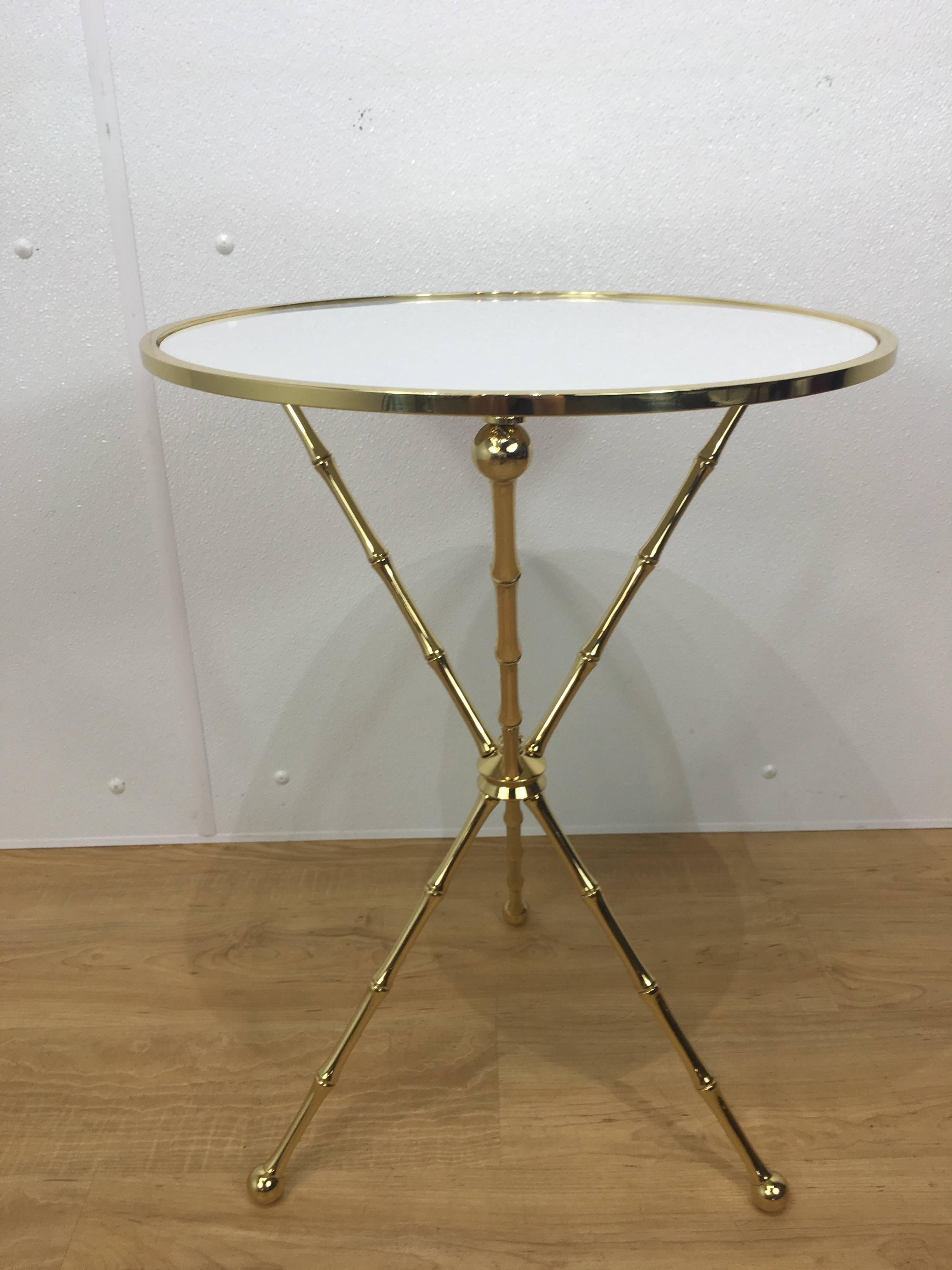 Maison Baguès bamboo motif table, of large-scale the circular top with inset white glass top, raised on bamboo motif tripod base, professionally polished.