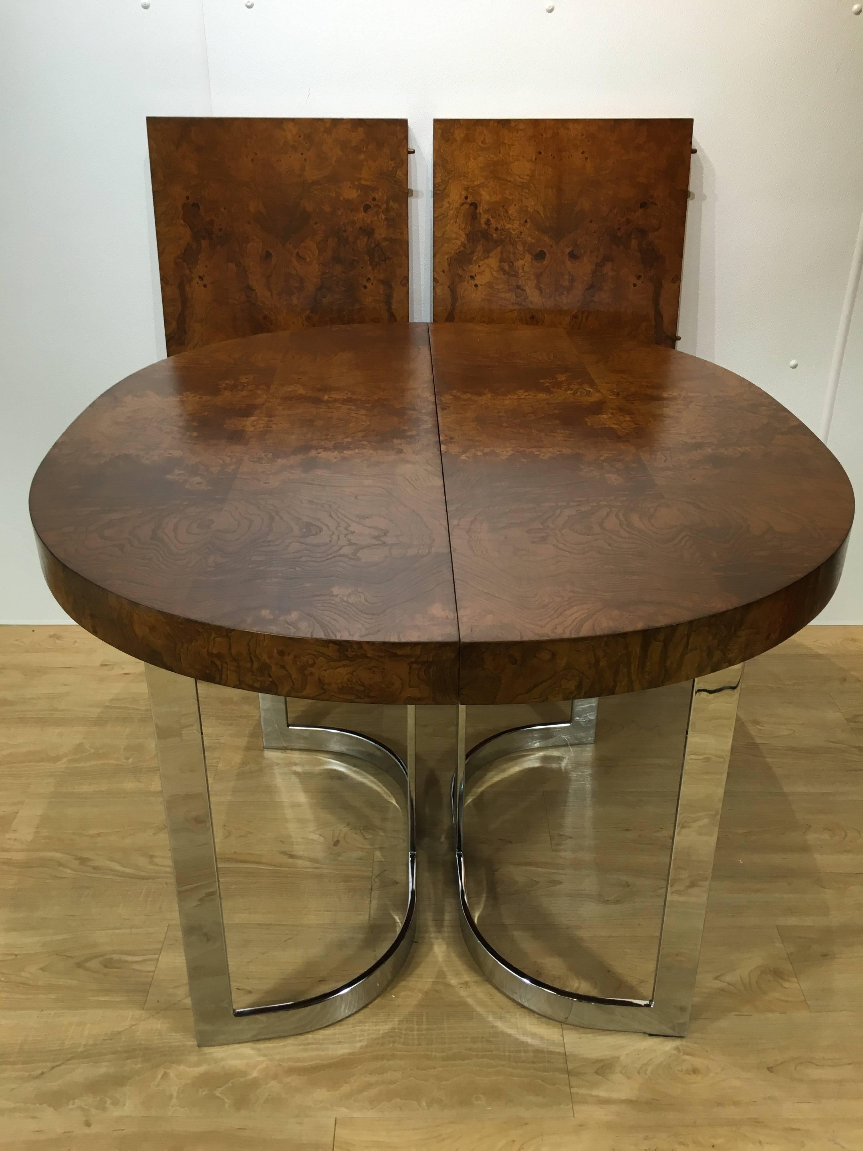 Stunning Milo Baughman burl wood dining table with chrome base. Wonderful grain to top and clean, bright chrome base. Measures: The table includes two boards measuring 18