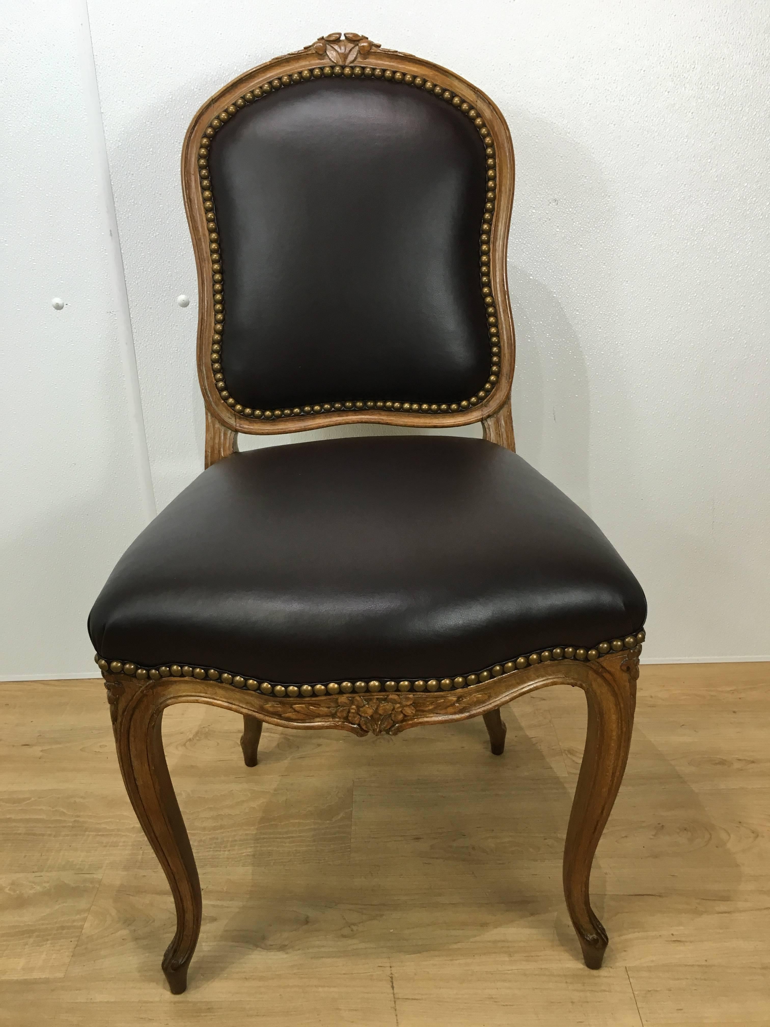 A set of eight Louis XV style walnut dining chairs with dark brown leather upholstery. Wonderful scale and proportions with new upholstery and cushions.
  