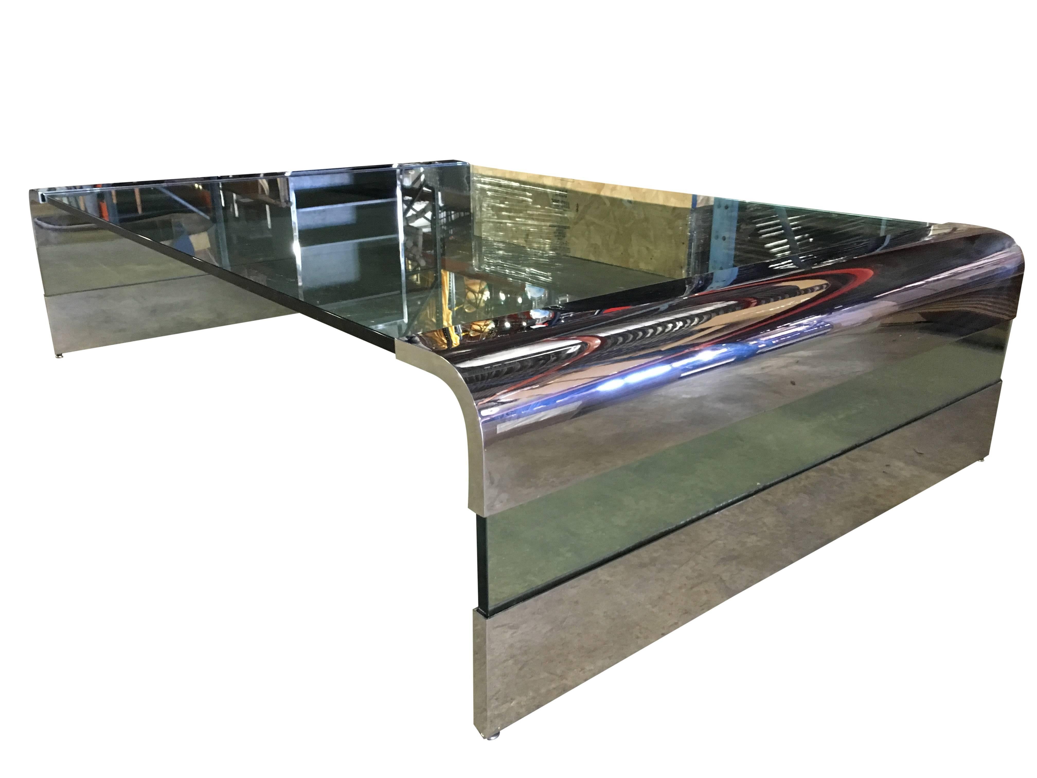 Massive chrome and thick glass coffee table by Pace Collection. Rare and large form with a dramatic presence. Retains original 