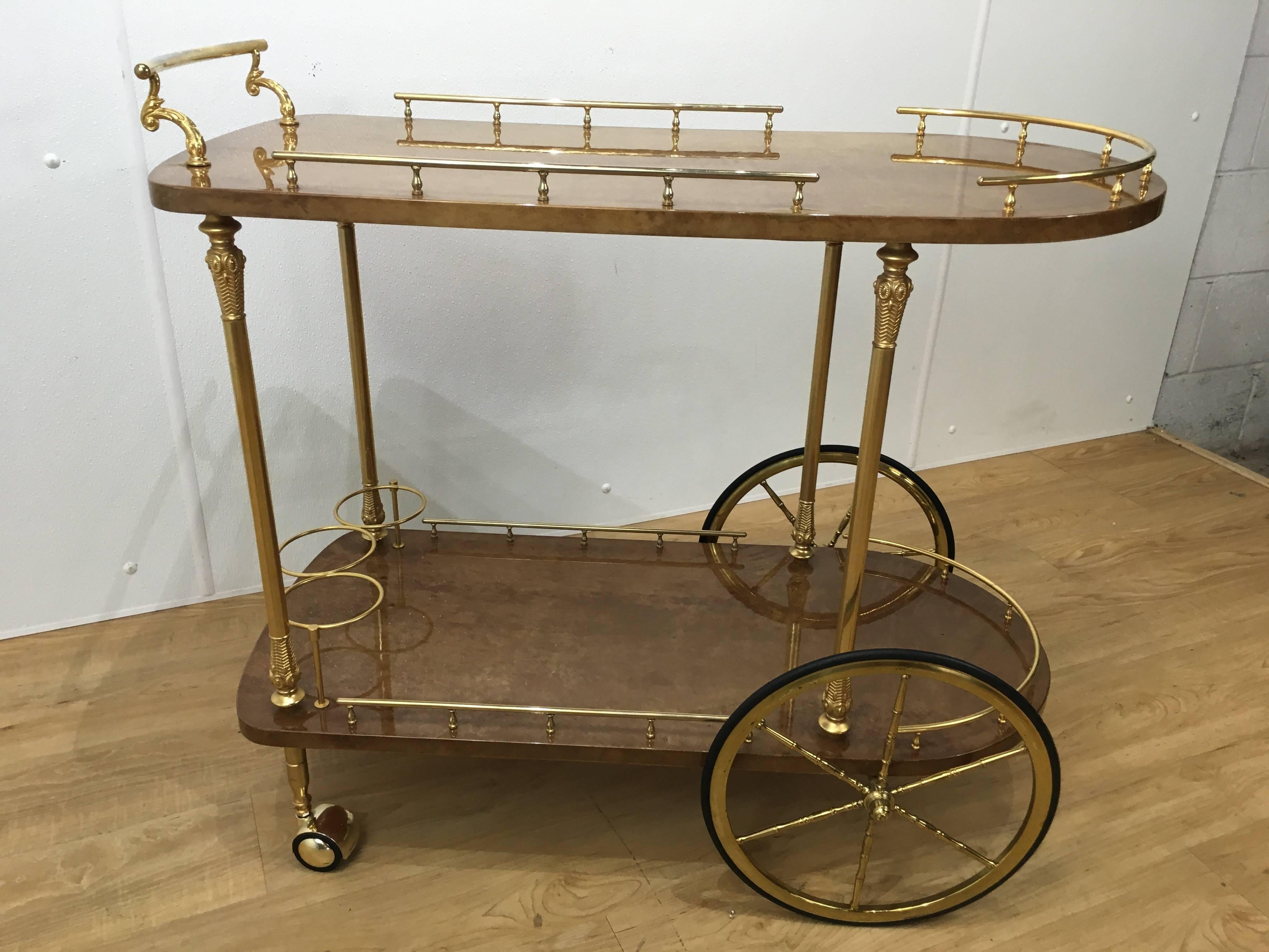 Aldo Tura goatskin bar cart with gilt brass gallery, bottle holder and wheels. Wonderful proportion and soft muted goatskin.