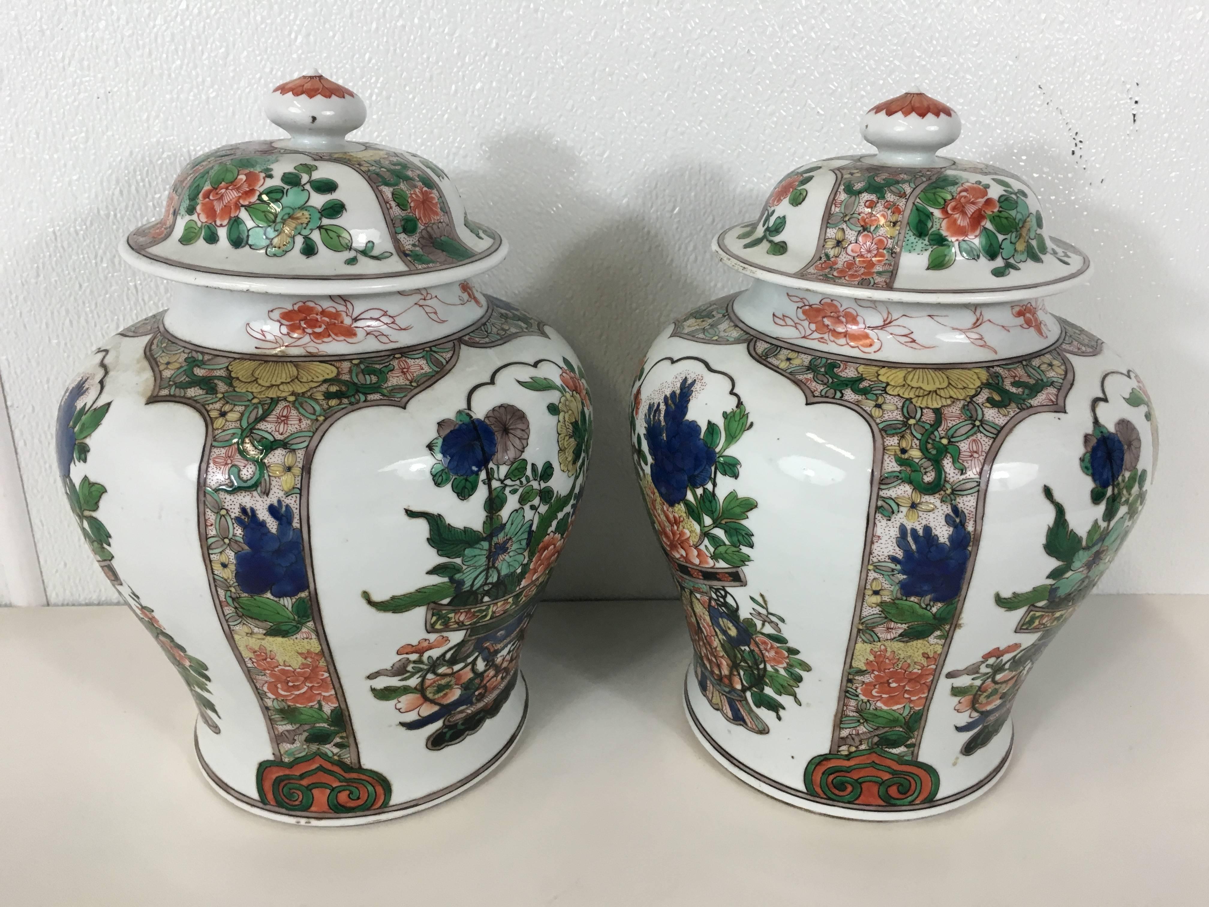 Pair of Samson famille verte temple jars, in the style of Chinese export. Painted with beautiful vignettes of baskets of flowers. Marked with Samson cypher.