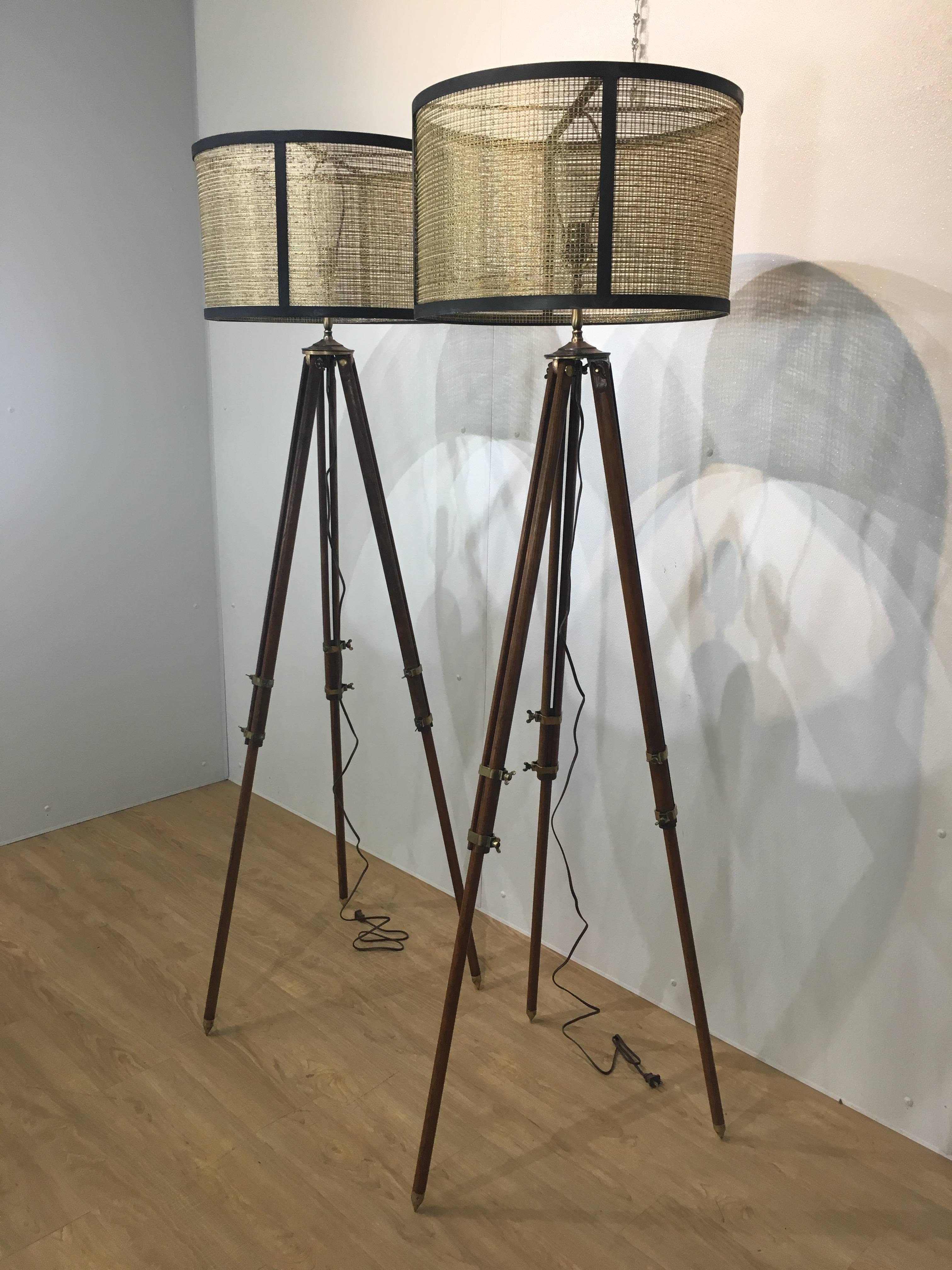 Pair of antique Surveyor floor lamps, each one of wood and brass mounts, adjustable fittings. With custom gilt mesh and patinated metal drum shades.
Shade measures 19.25" W x 12" H.
Adjustable height between 40" and 64"