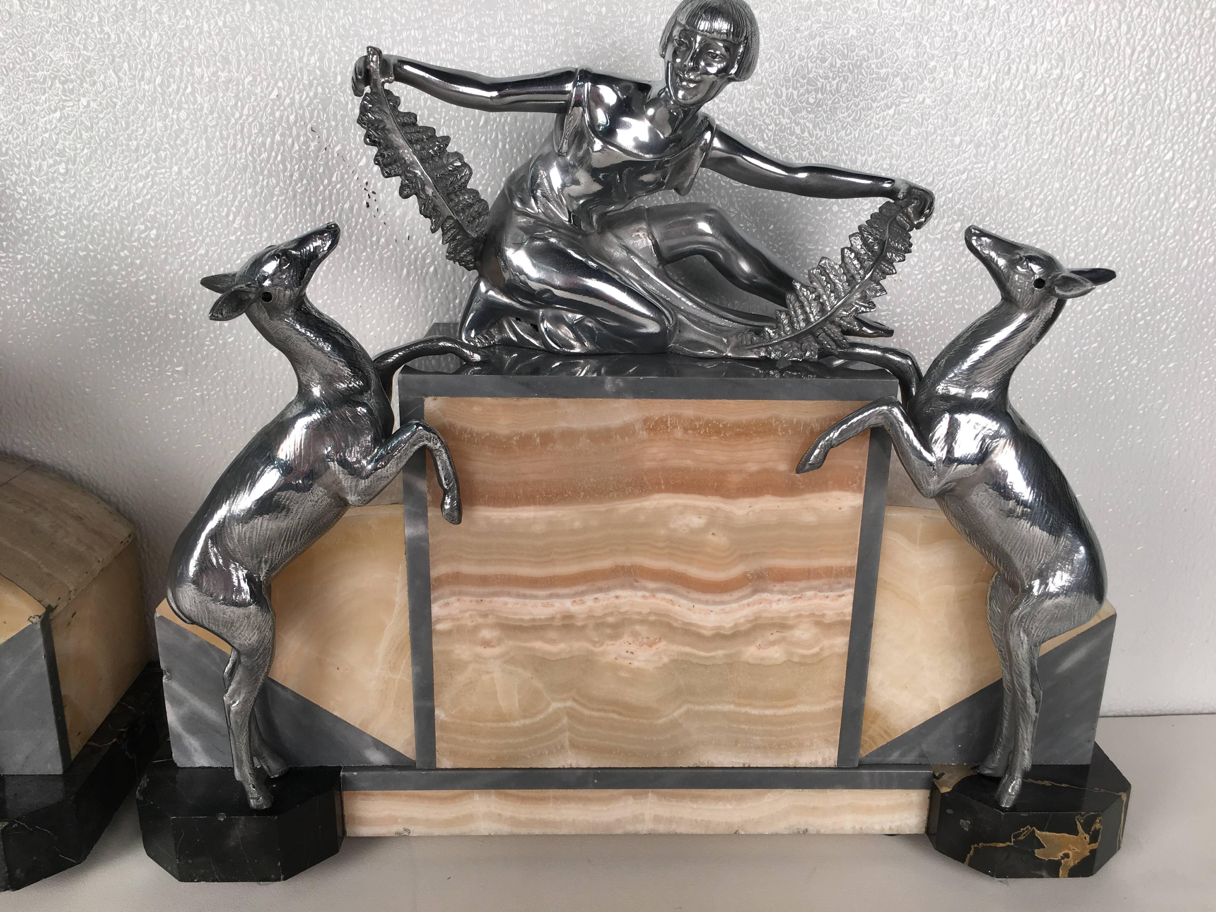 French Pair of figural Art Deco Silverplated  and Onyx Lamps For Sale
