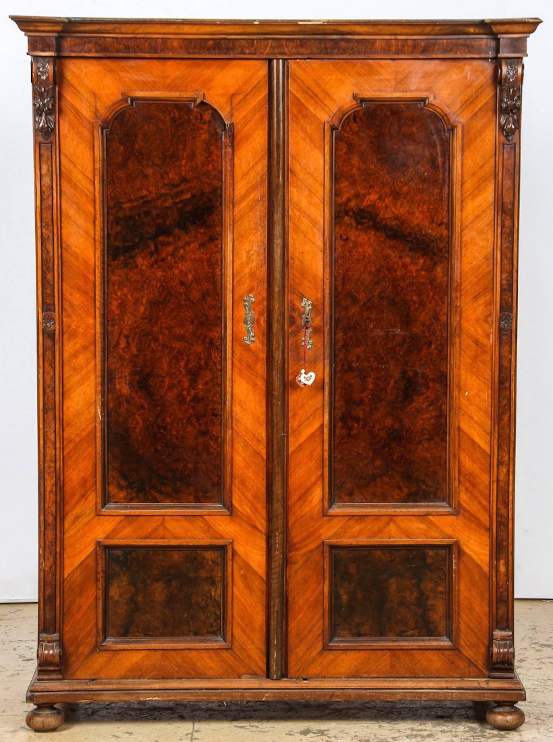 Pair of diminutive Napoleon III burl armoires, a rare find, a true pair, each one standing 67.5 inches high with exotic burled walnut and Honduran mahogany double doors.

 