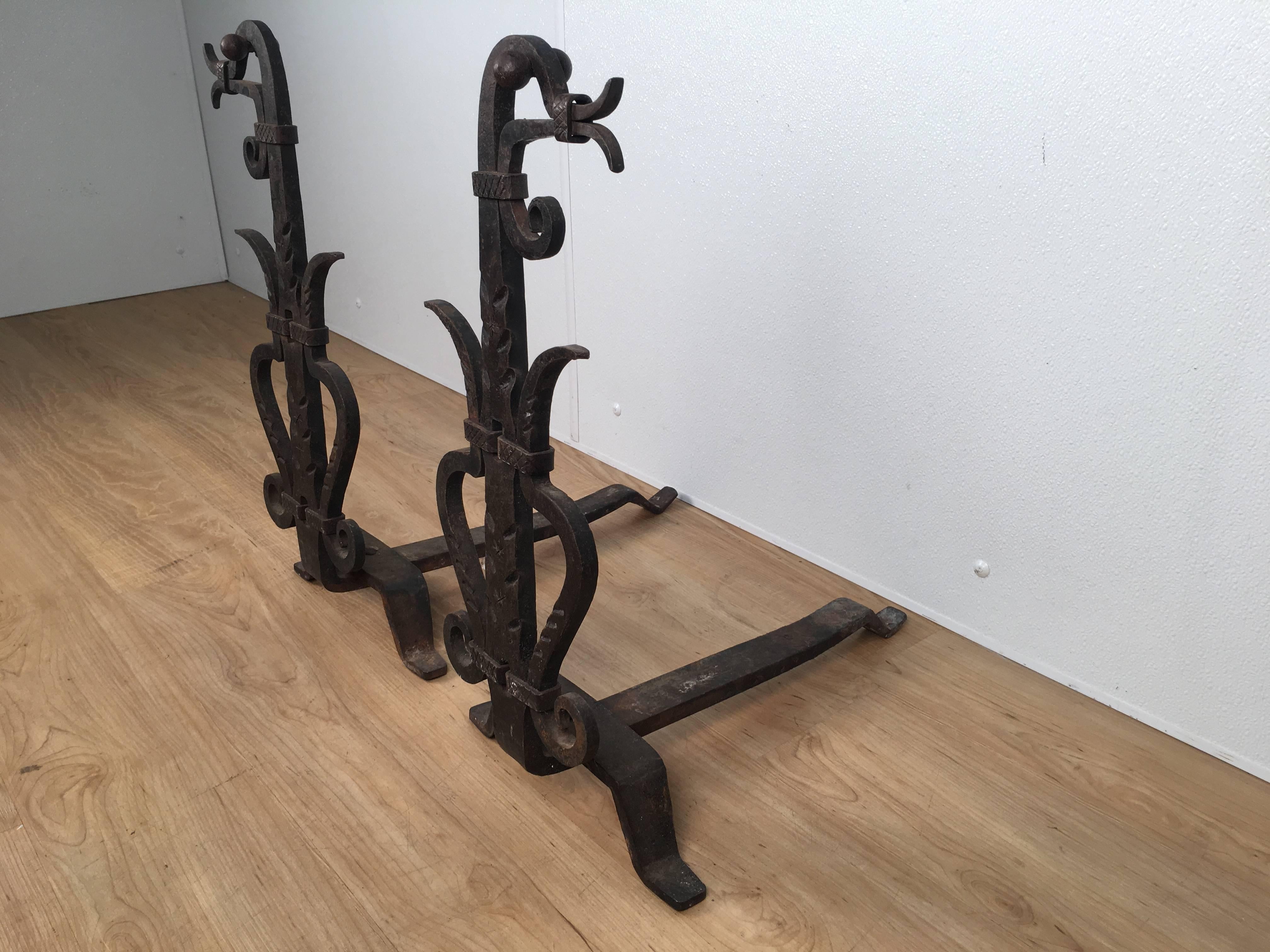 Pair of wrought iron figural andirons, each one hand forged in the form of a standing bird, facing left and right.