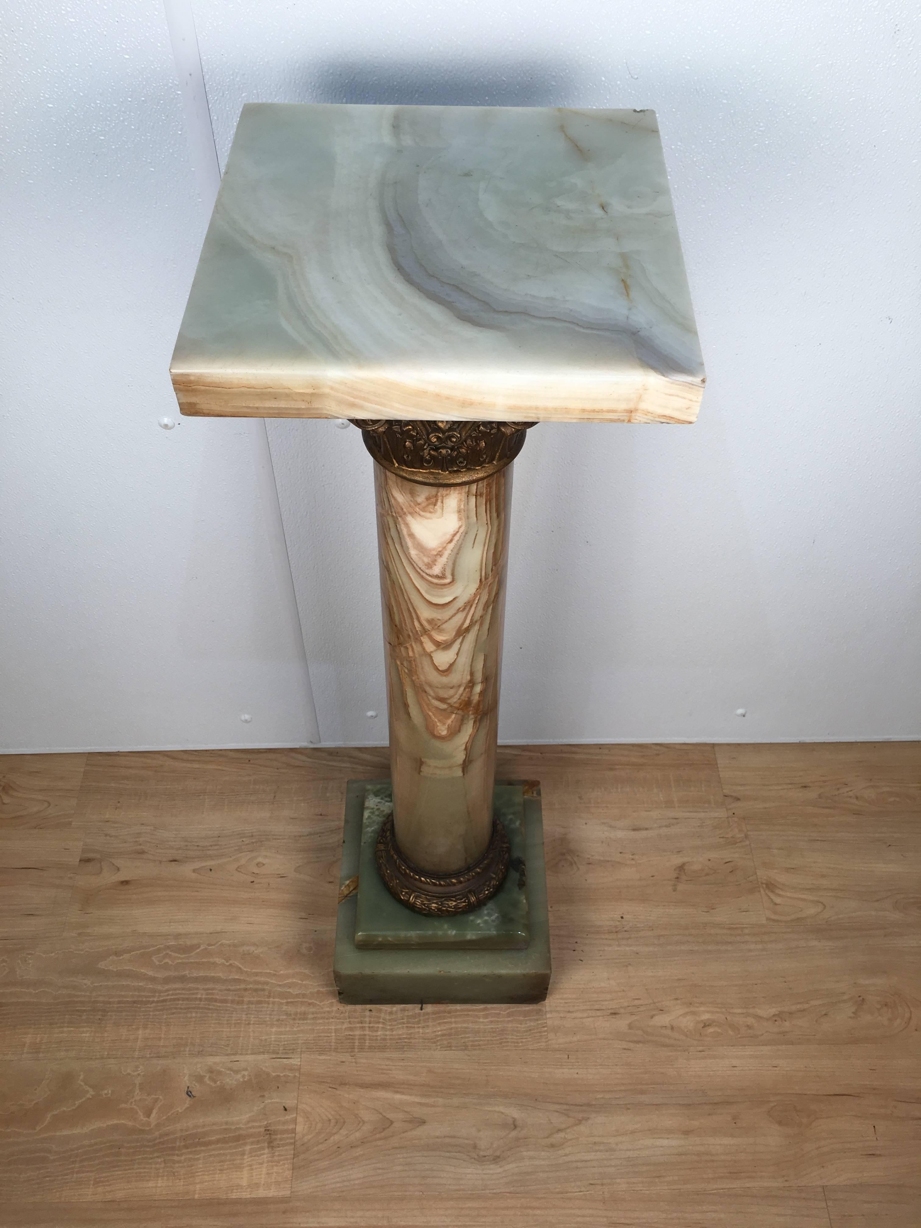 Onyx pedestal with gilt bronze Corinthian capital. Beautiful striations to stone. Similar pedestal available. Please refer to last image, this listing is for the pedestal on the left. Top of pedestal measures 11