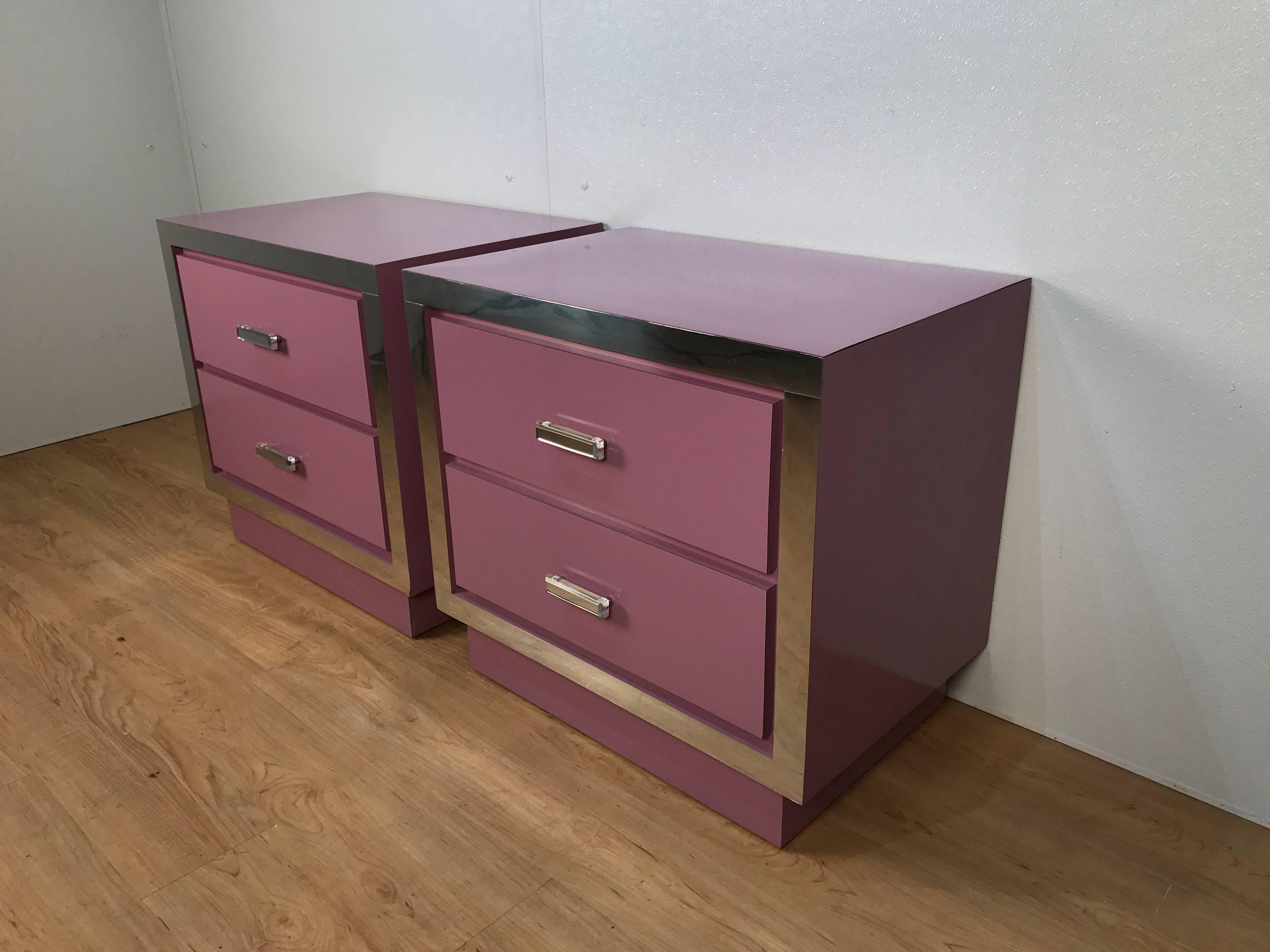 Pair of Mid-Century lilac lacquered nightstands or end tables, each one fitted with two drawers, chrome surround and Lucite pulls.