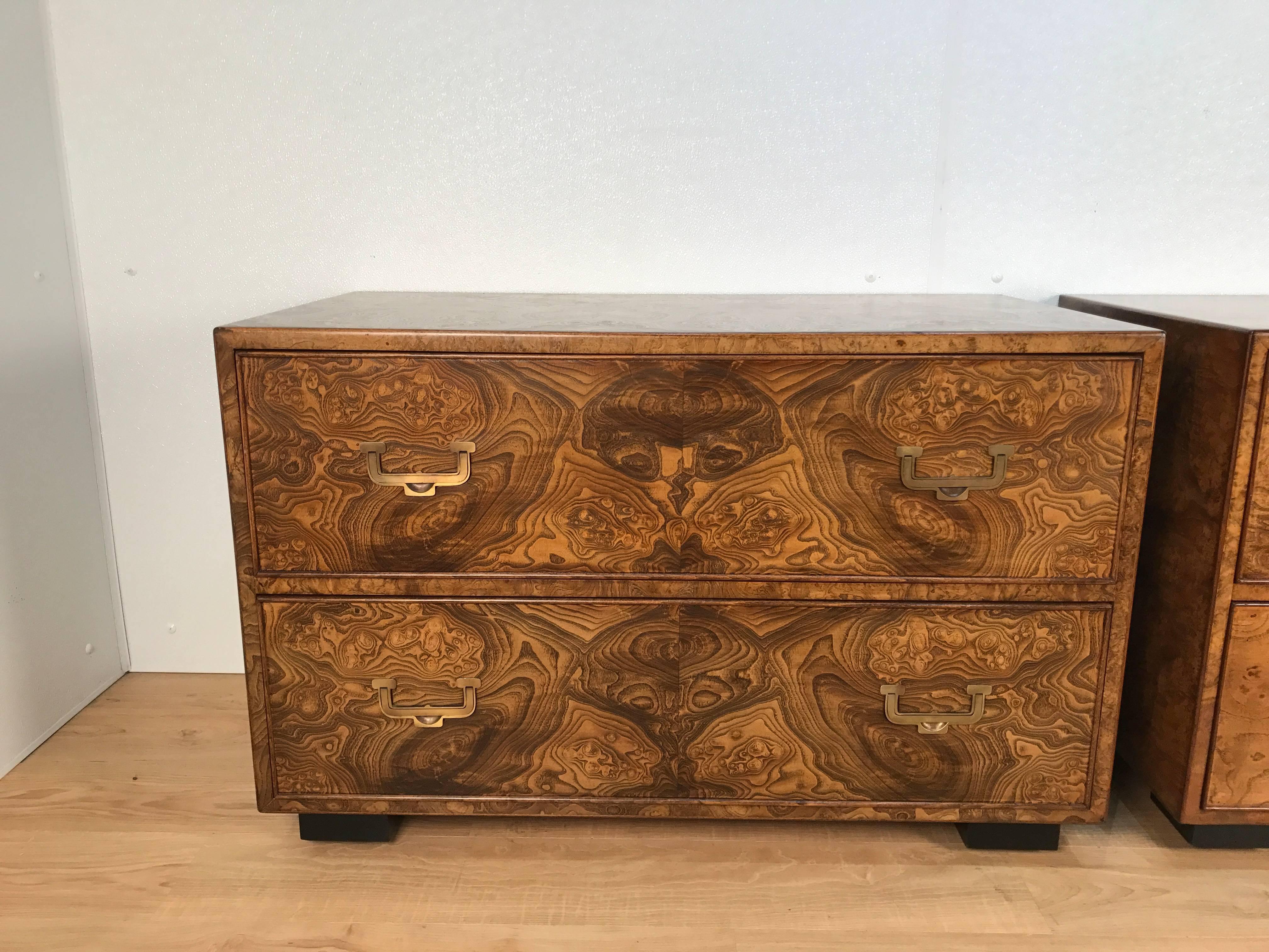 Stunning pair of burl wood campaign style two-drawer chests by John Widdicomb. Very similar, one slightly darker with more wood variations. Presents well together on either side of sofa or bed. 