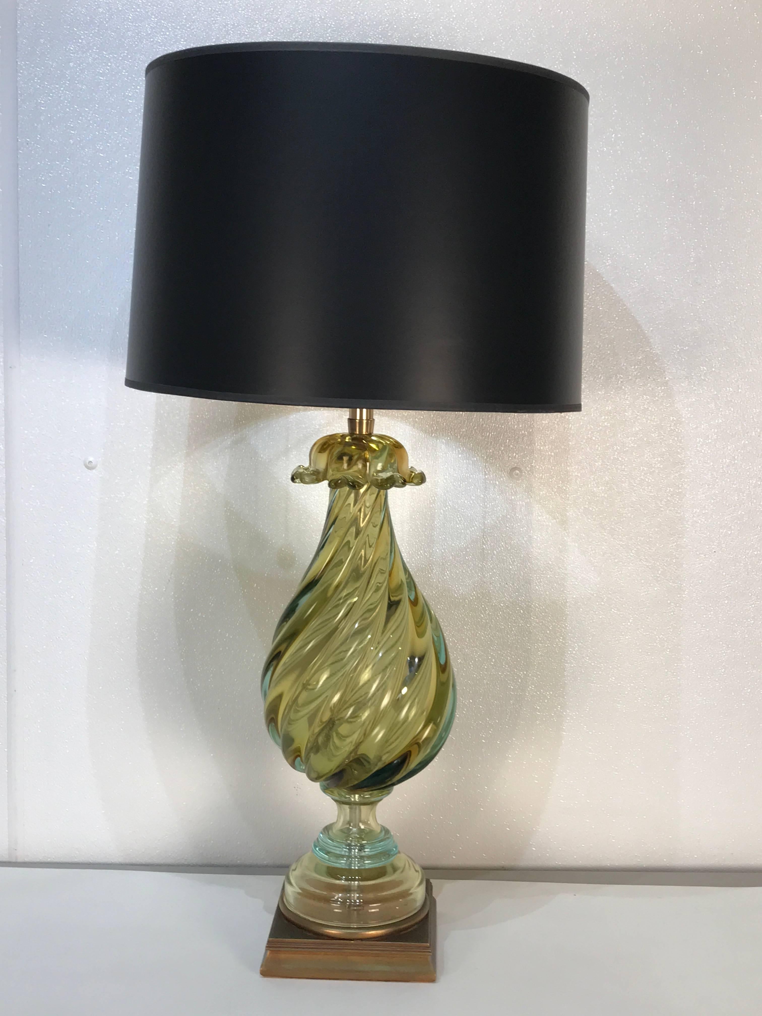 Pair of stunning gold Murano glass lamps, each one of tall Cassolette form, with flash of aqua near the pedestal bases. Labeled Marbo Lamp Company.
The glass urn measures 7