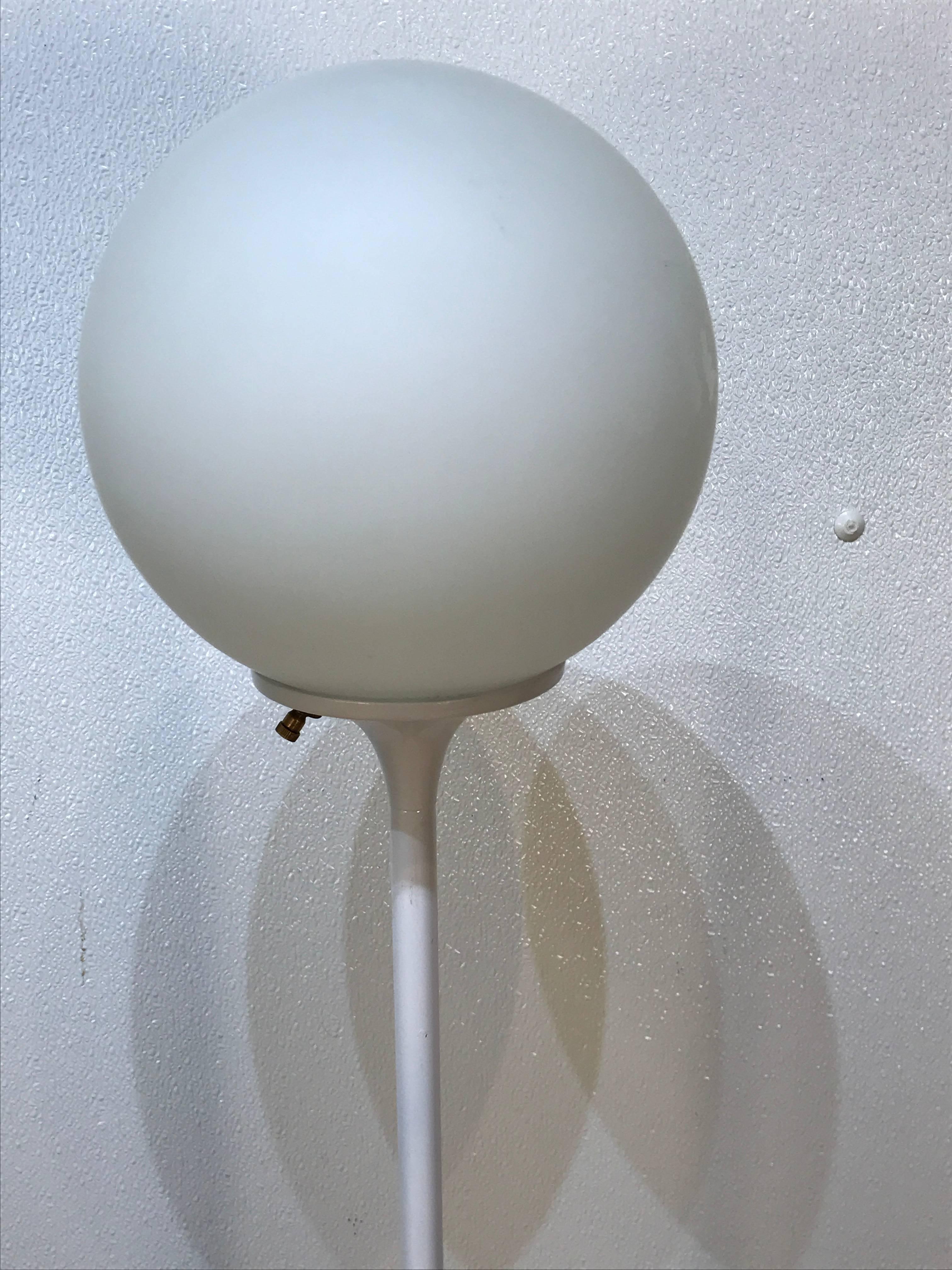 Saarinen style floor lamp with white ball shade.