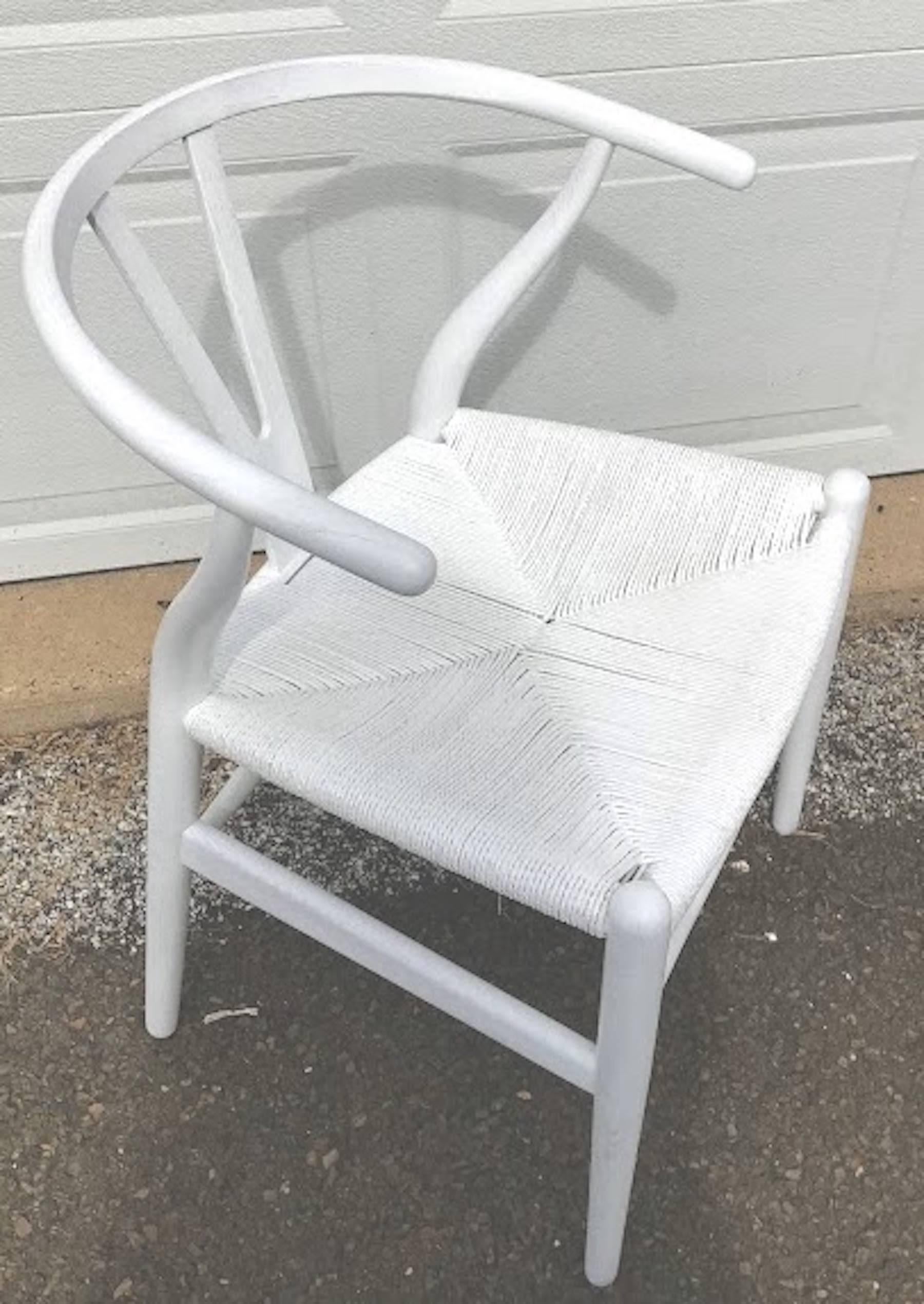 Set of four Hans Wegner Wishbone chairs, CH24. In white. The entire chair is polychromed/stained/cerused in white, as we found them from a Princeton NJ estate.