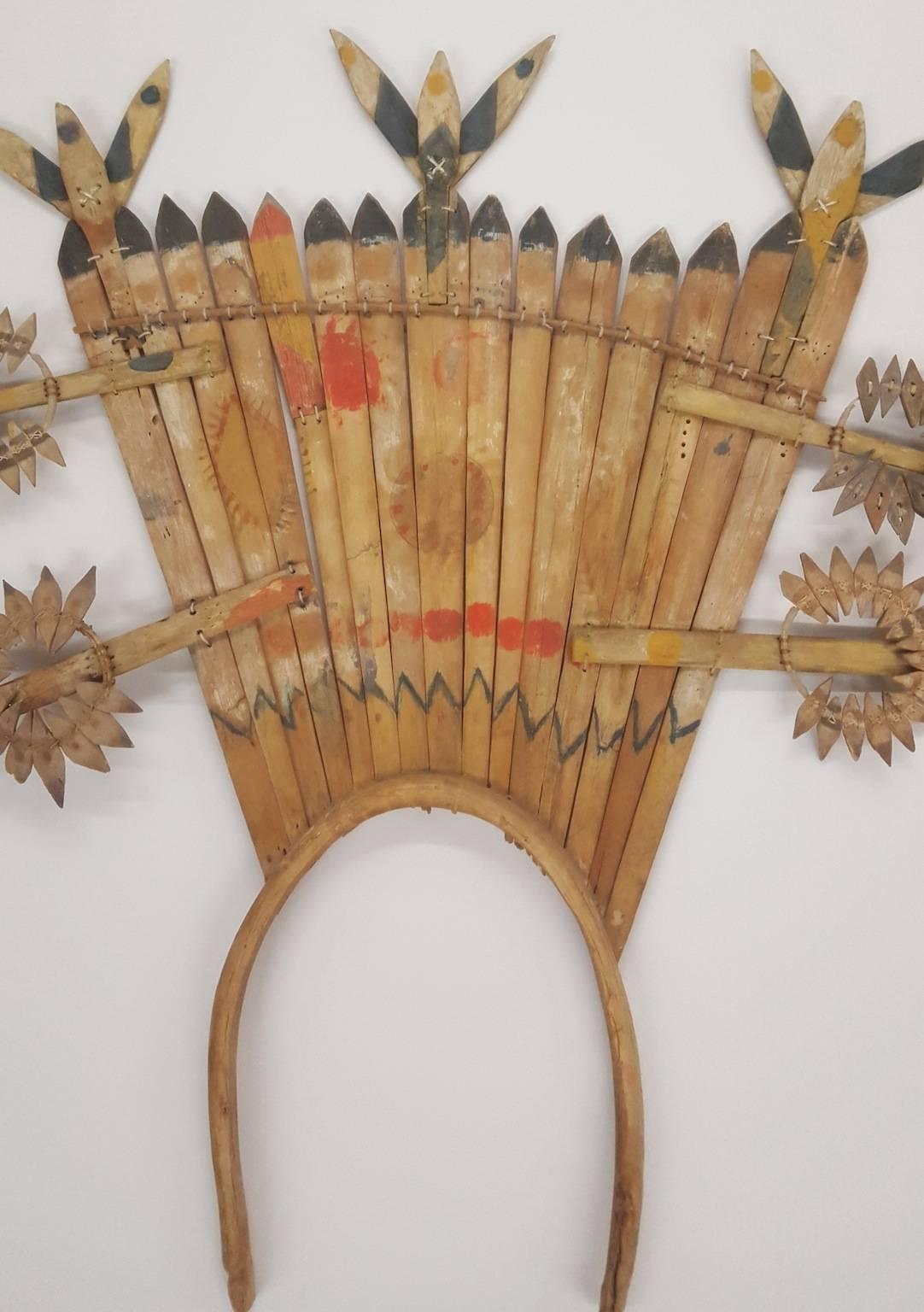 A Native American Apache mountain spirit crown and dance wands of pine wood slats, paint and cotton string. Handmade and painted circa 1930 head dress and wands used in mountain spirit dance ceremonies. Two dance wands (to be carried in each hand)