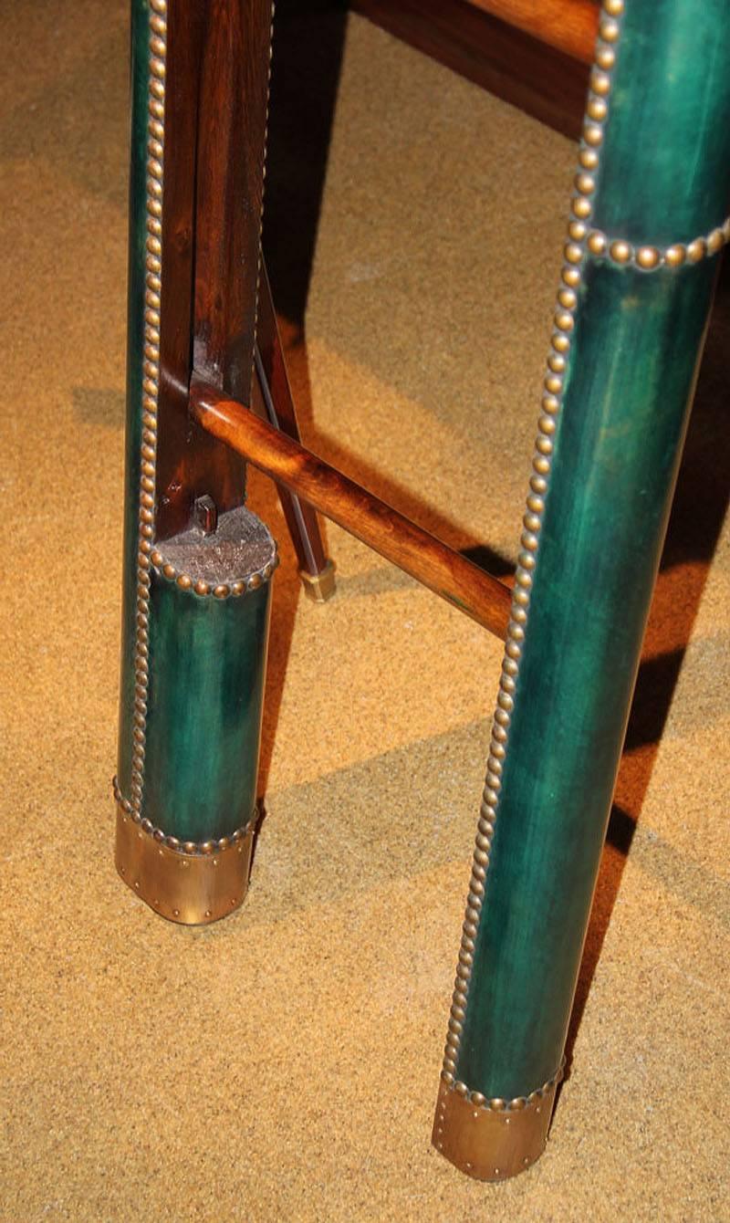 A C. Mariani custom mahogany folding library ladder in the English taste, with forest green leather sides, available in custom colors and with brass nailhead trim. Made to order; lead time 14-16 weeks unless otherwise agreed.